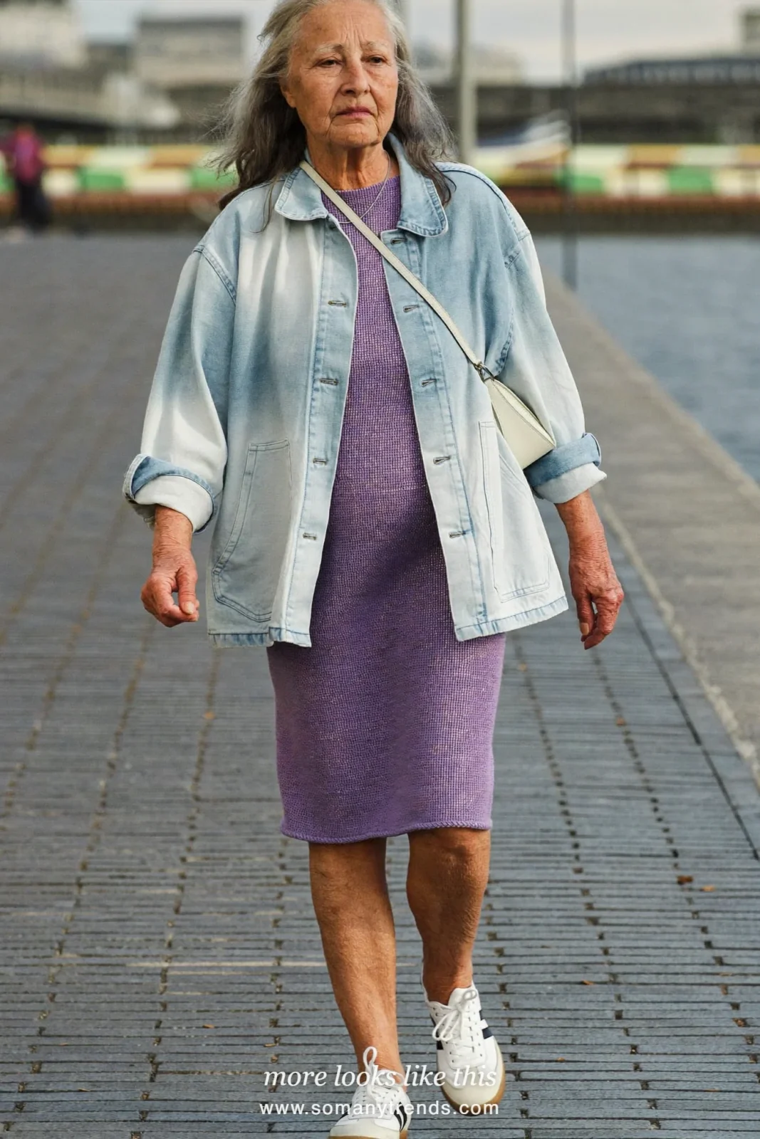 Woman in her seventies in a lilac knit dress, light denim jacket and white sneakers, look 18
