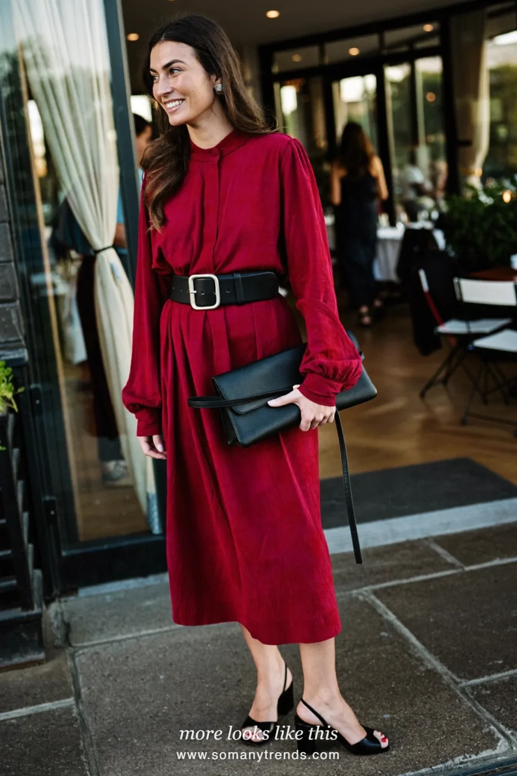 Woman in a wine crepe long-sleeve midi dress with wide belt and black block-heel sandals, wedding guest outfit 2