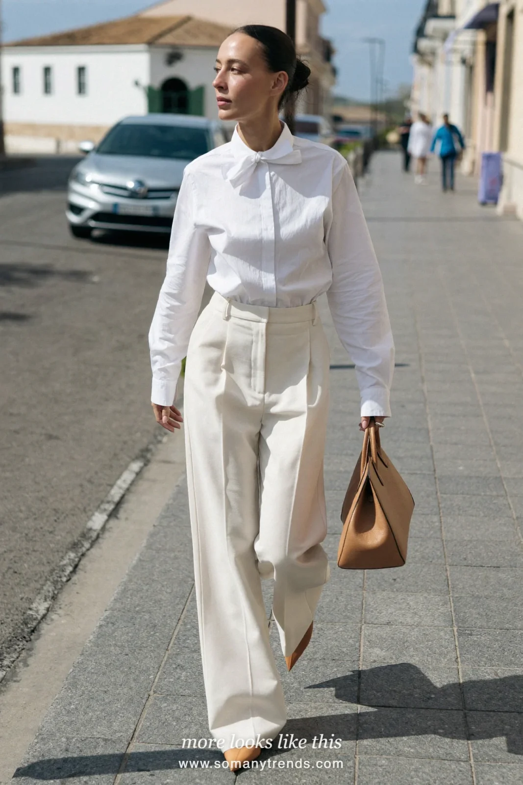 Woman in a white poplin shirt with a collar bow, ivory wide-leg pants and tan pointed flats, Easter outfit 2