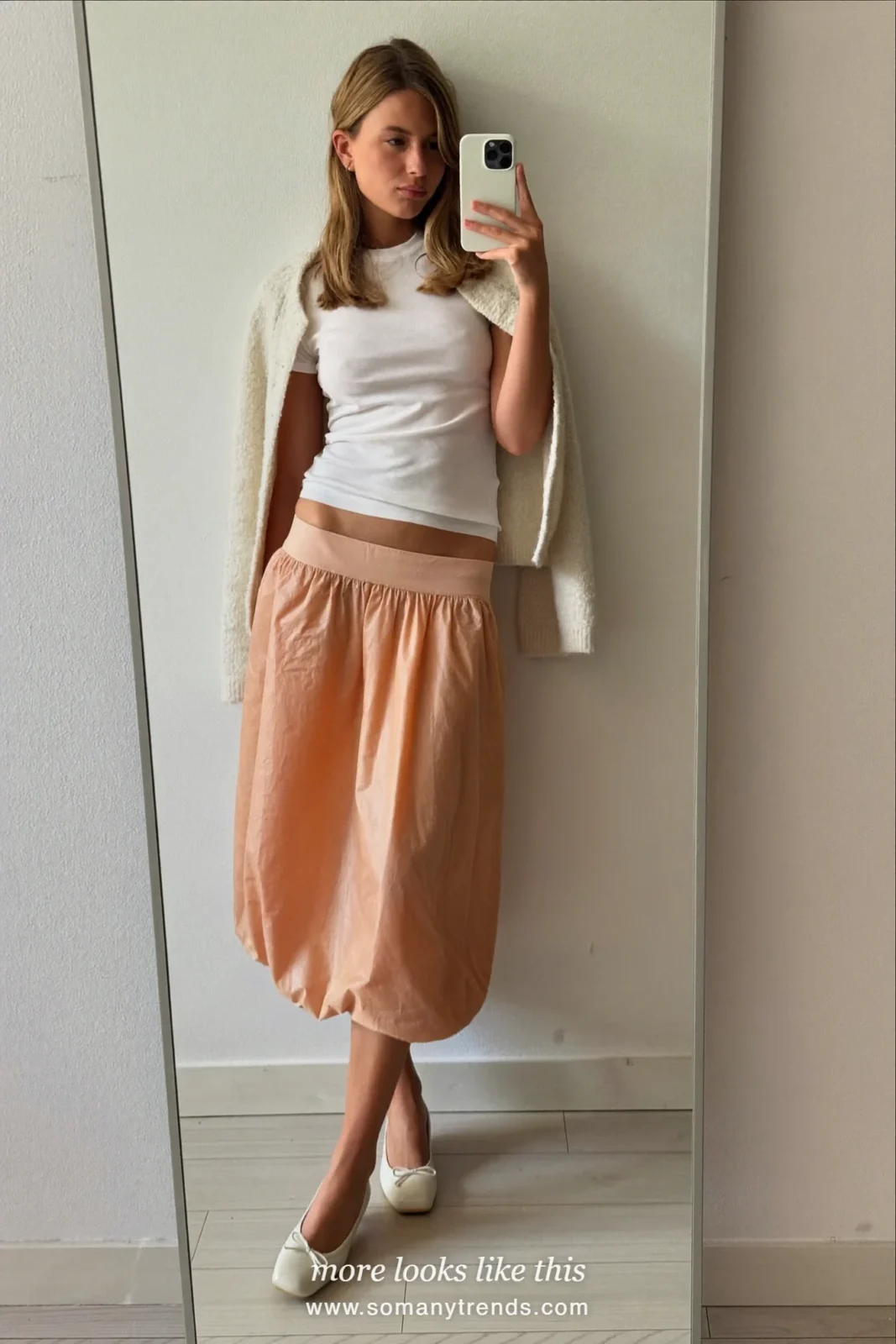 Woman at home in a fitted white tee, peach bubble midi skirt and ivory cardigan, mirror selfie, Easter outfit 4