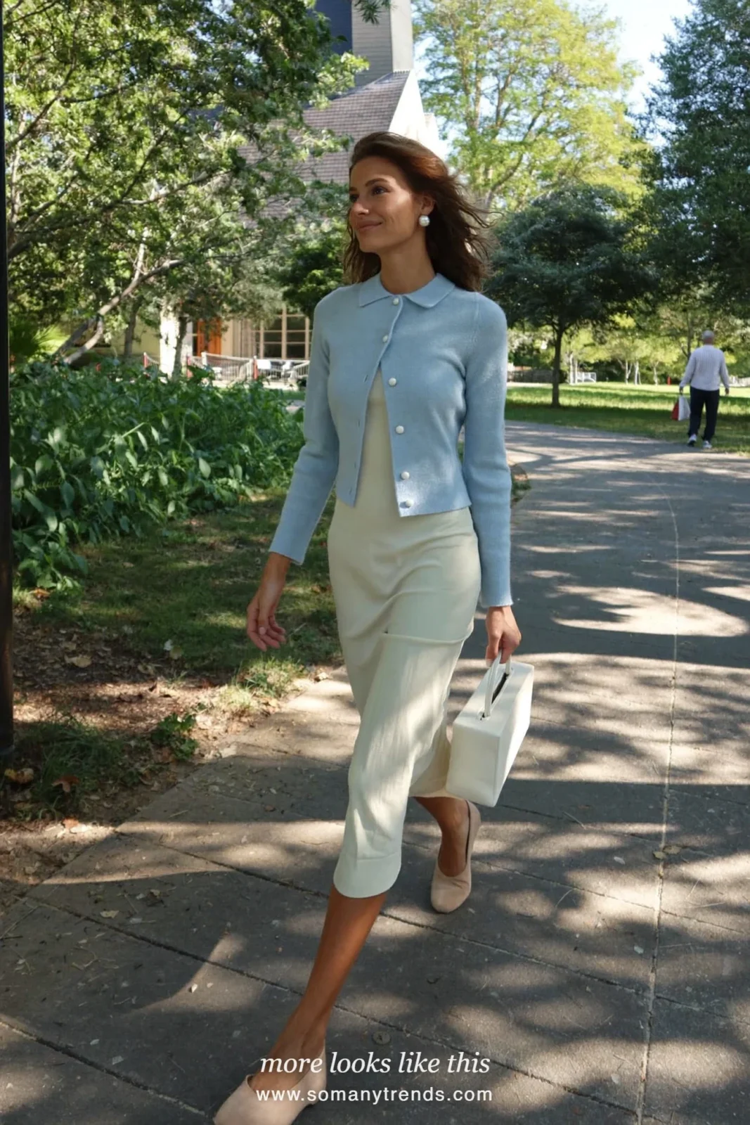 Woman in a cream midi dress, sky blue cardigan and nude flats, Easter outfit 7