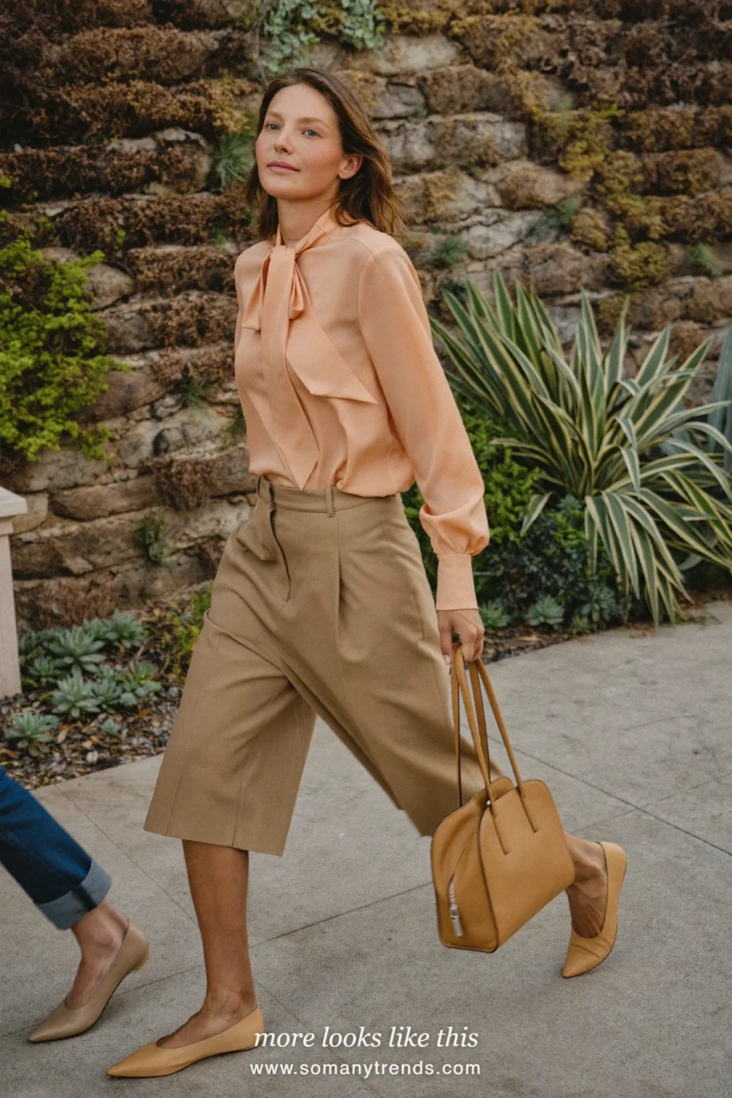 Woman in tan culottes, peach bow blouse and pointed flats, Easter outfit 14