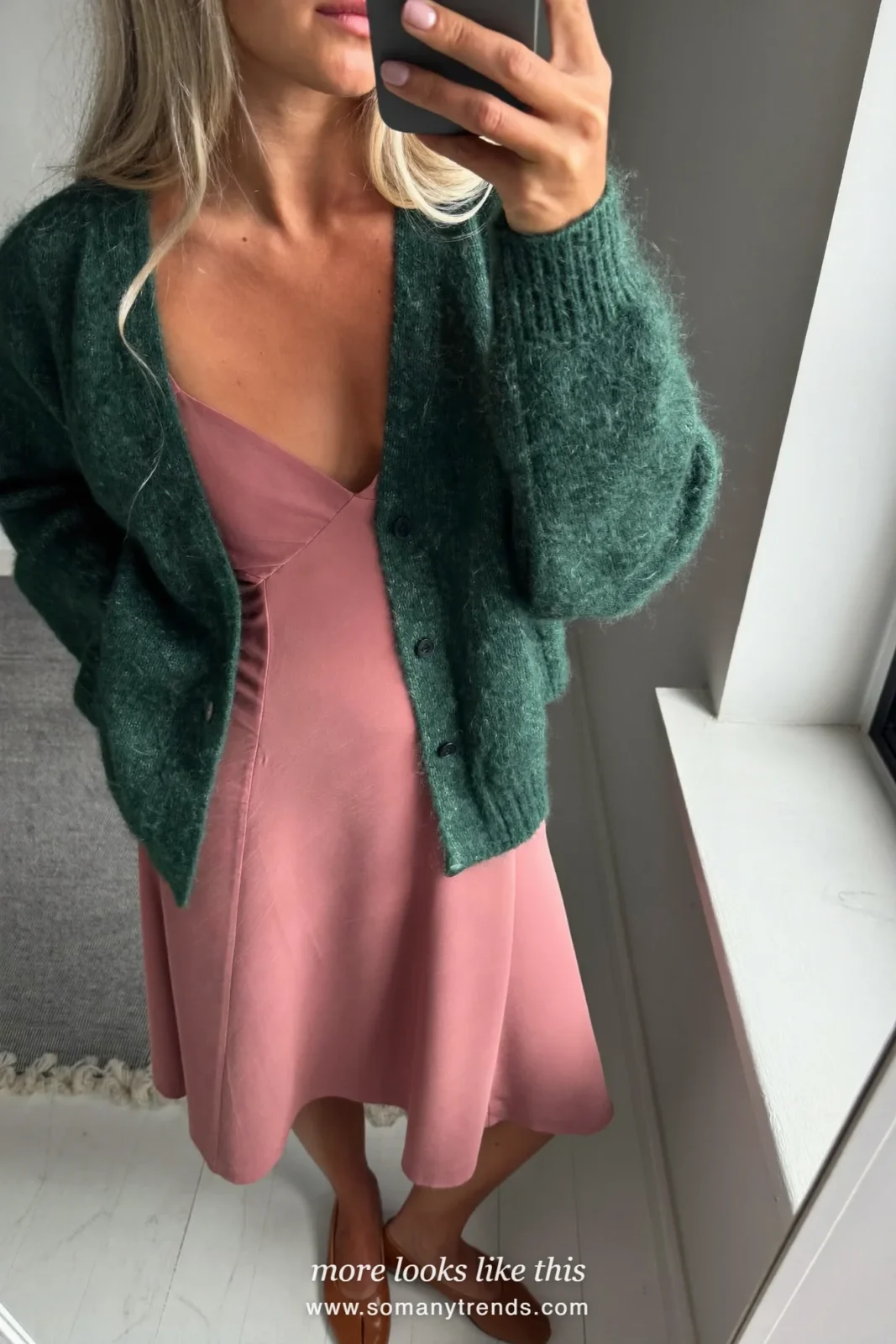 Woman at home in a soft pink midi dress, forest green cardigan and tan flats, mirror selfie, Easter outfit 16
