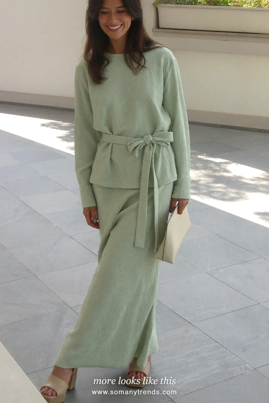 Woman in a mint woven top and matching long skirt with bow belt and nude sandals, Easter outfit 23