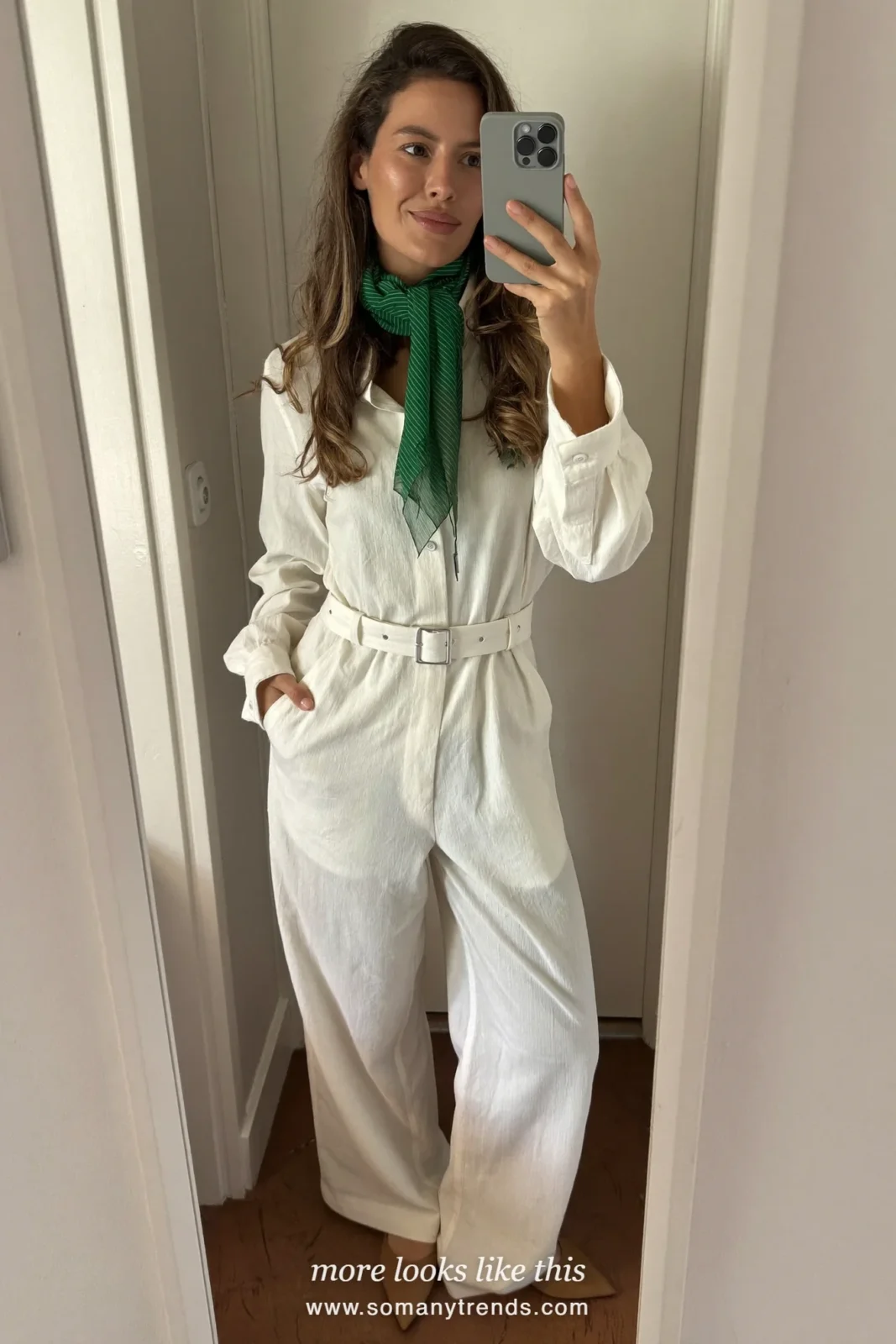 Woman in an ivory wide-leg jumpsuit with a forest green neck scarf and tan pointed flats, Easter outfit 24