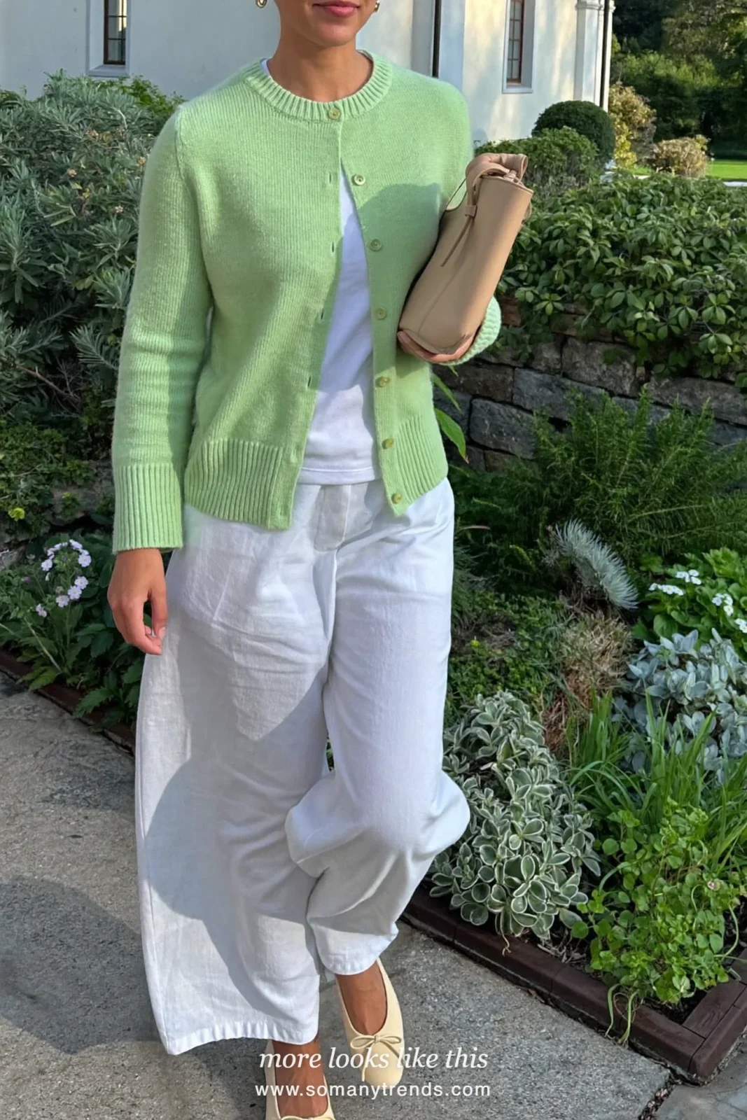 Woman in a mint cardigan, a white tee, white wide-leg pants and bow flats, Easter church outfit 11