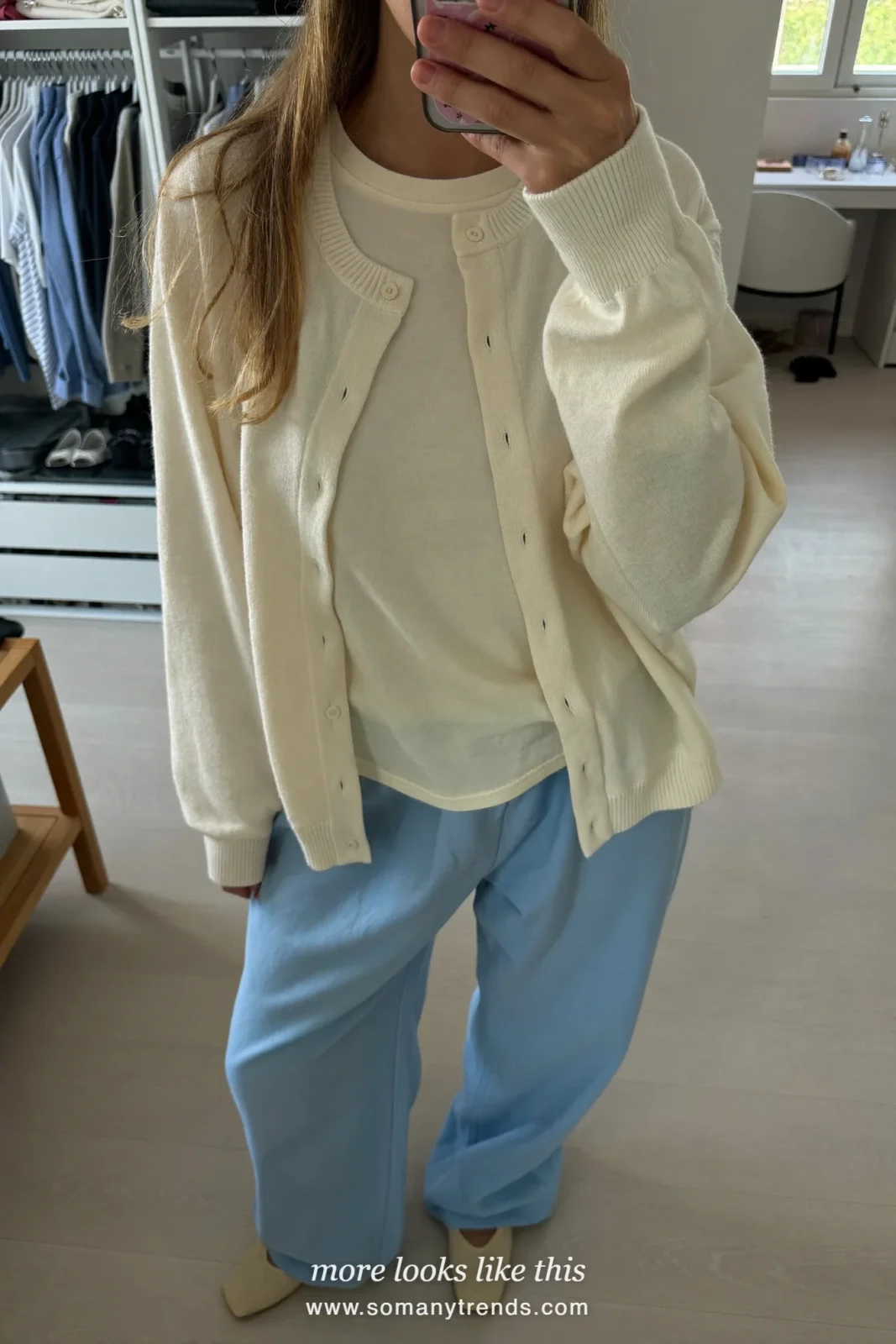 Woman in a cream cardigan and tee set with sky blue wide-leg pants and cream flats, Easter church outfit 20
