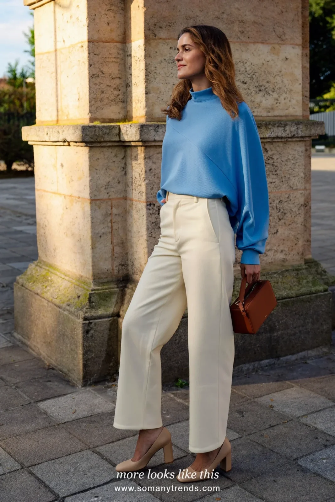 Woman in a sky blue long-sleeve blouse, cream wide-leg pants, a thin belt and tan block heels, Easter church outfit 23