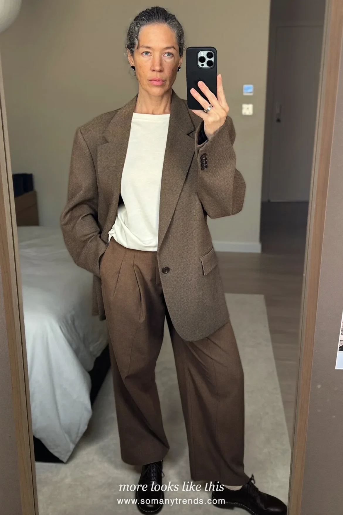 Look 8: tonal brown relaxed blazer and wide pleated pants, cream tee and dark brown derby shoes