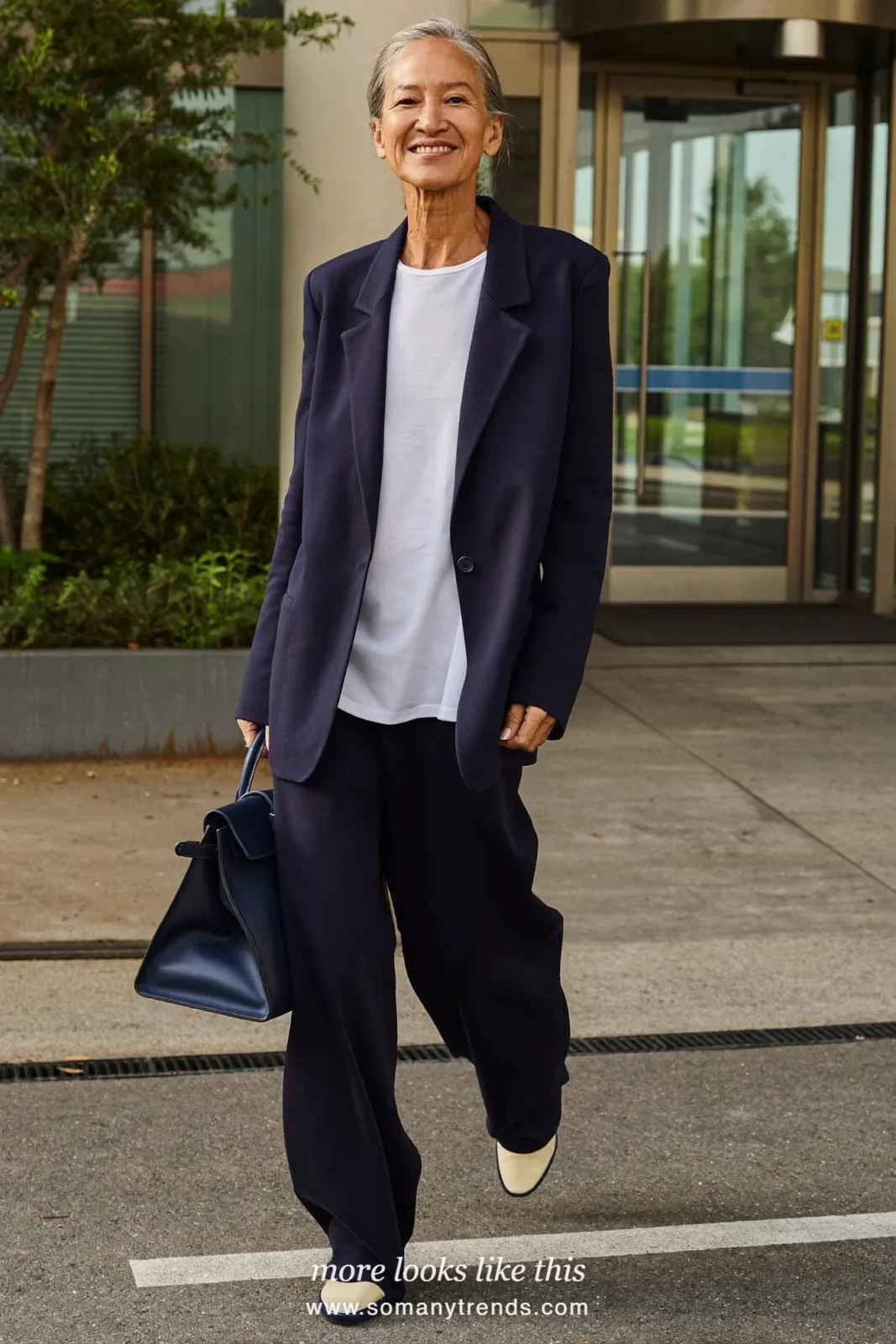 Look 13: navy relaxed blazer and wide-leg pants, white cotton shell and cream and navy two-tone pumps