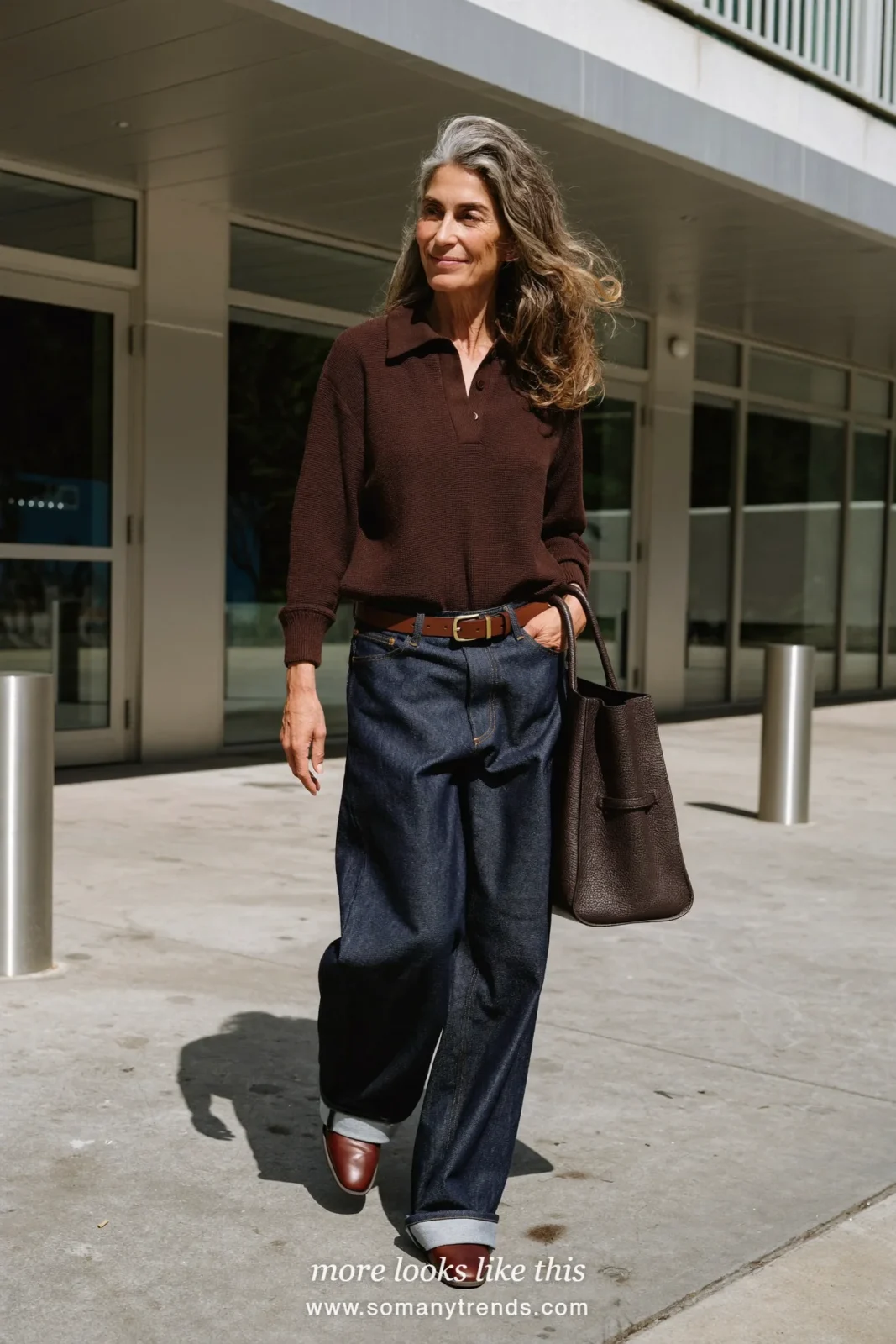 Look 27: chocolate brown knit polo, dark wide-leg jeans, brown leather belt and brown derby shoes
