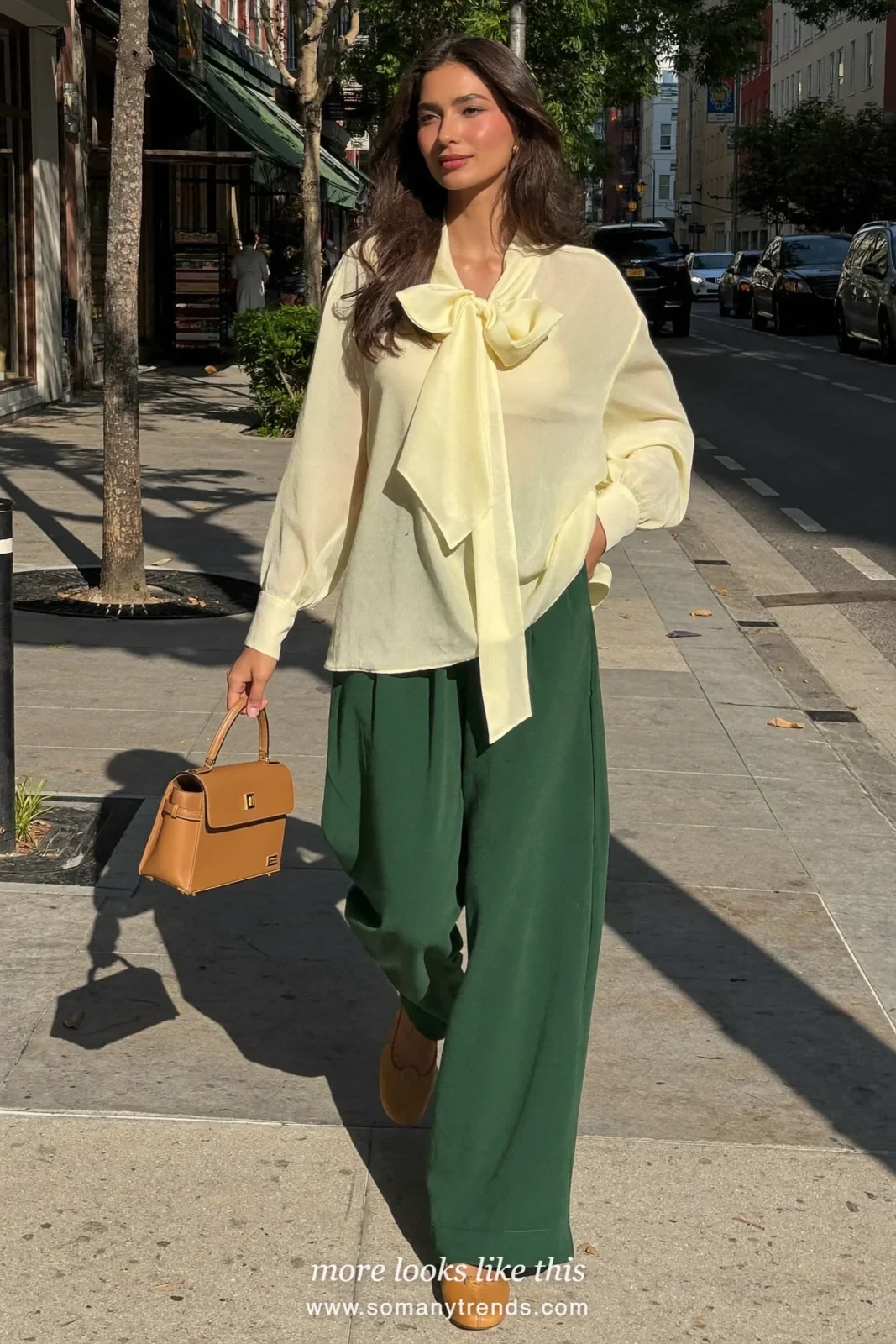 Woman in a limone bow blouse, forest green wide pants and tan flats, Easter outfit 27