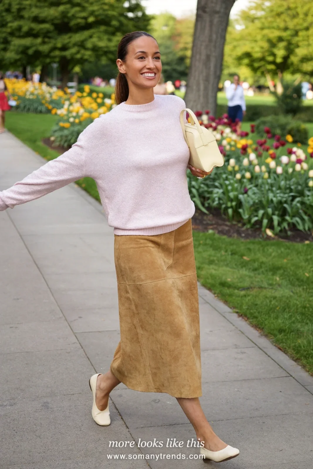 Woman in a pale pink sweater, tan midi skirt and ivory flats, Easter outfit 30