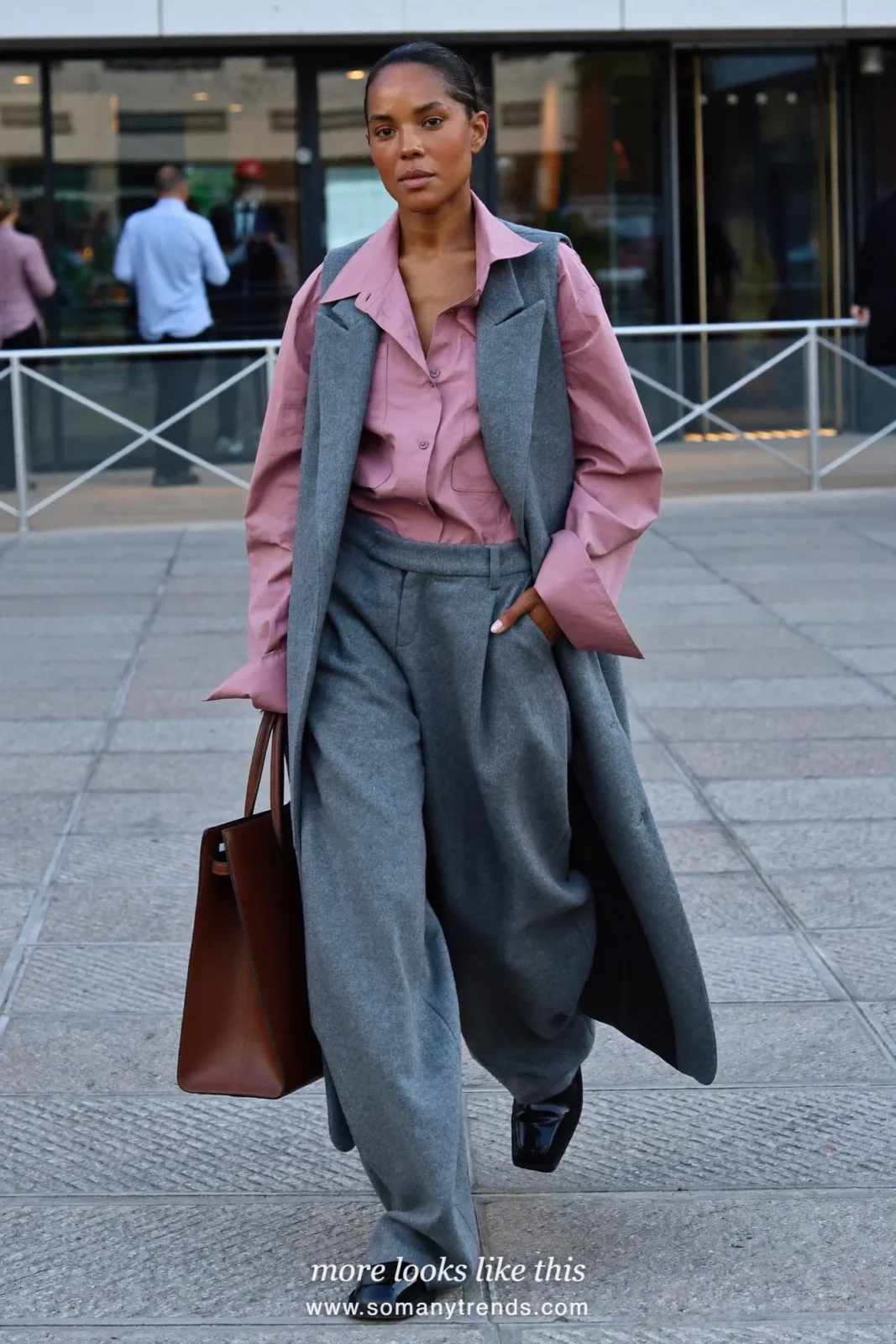 Woman in a gray tailored vest over a dusty pink shirt, gray wide-leg pants and black square-toe derbies, outfit 13