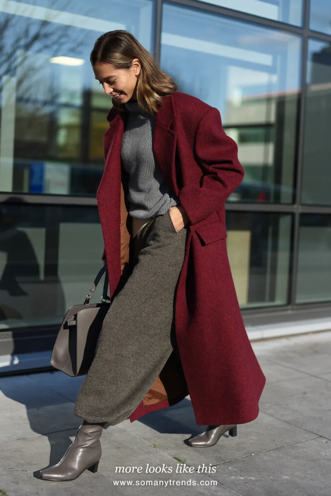 Woman in a long burgundy wool coat, gray knit, gray wide-leg pants and gray square-toe boots, outfit 21