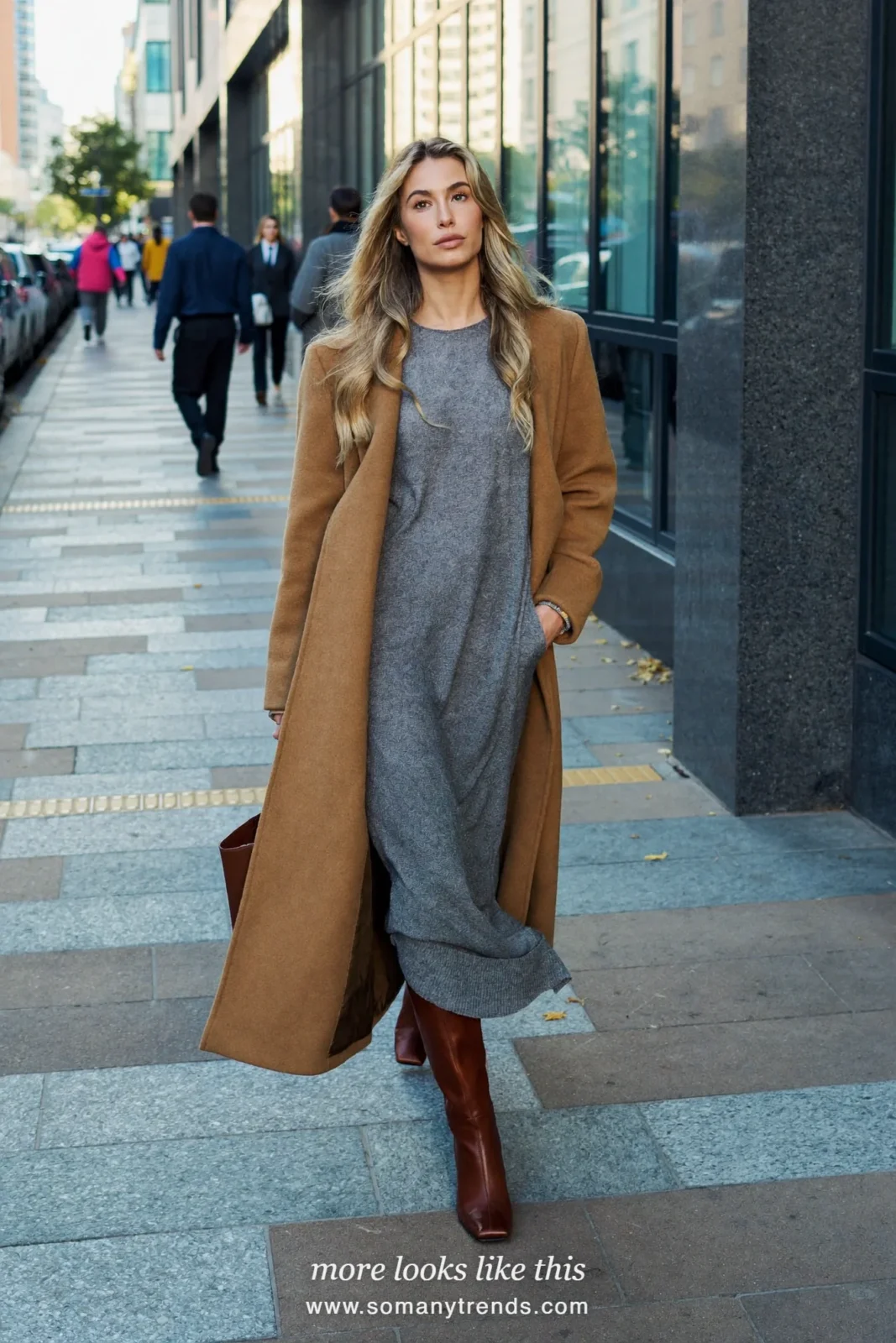 Woman in a loose gray knit maxi dress, long belted camel coat and brown square-toe boots, outfit 27