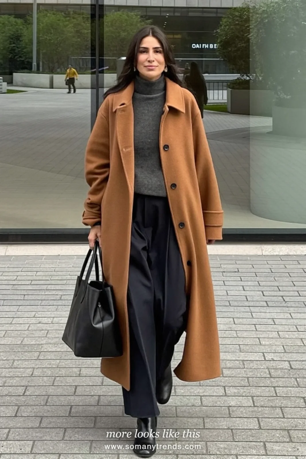 Woman in a camel long cardigan coat, charcoal turtleneck, black straight pants and black ankle boots outside a convention center, work conference outfit 11