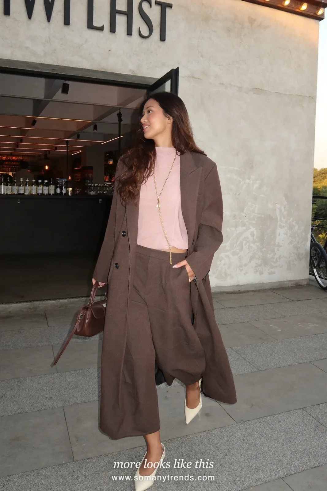 Look 21: espresso wide-leg suit with pale pink camisole and long chain