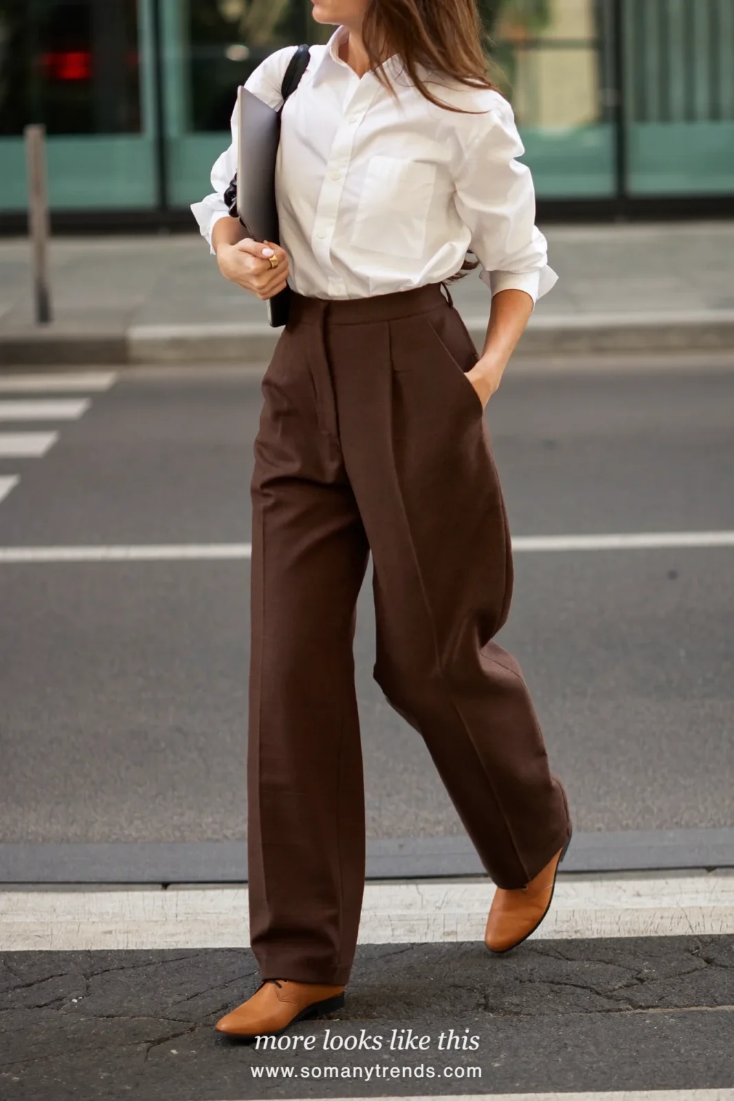 Woman in a white button-up shirt, chocolate brown straight pants and tan leather derby shoes, first day at work outfit 5