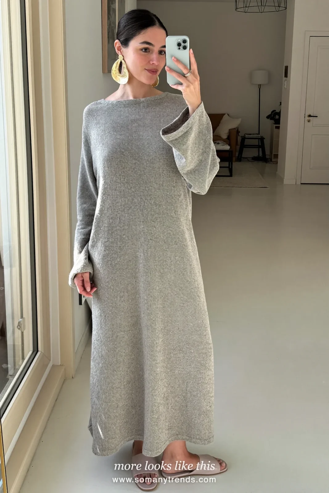 Look 12: soft gray knit column maxi dress with bold earrings, mirror selfie at home in the living room