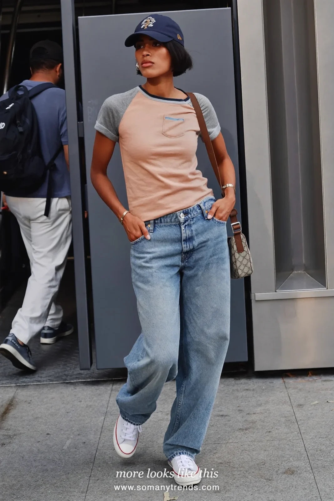 Blush and gray raglan baseball tee with straight-leg blue jeans, white sneakers and navy baseball cap, outfit 2