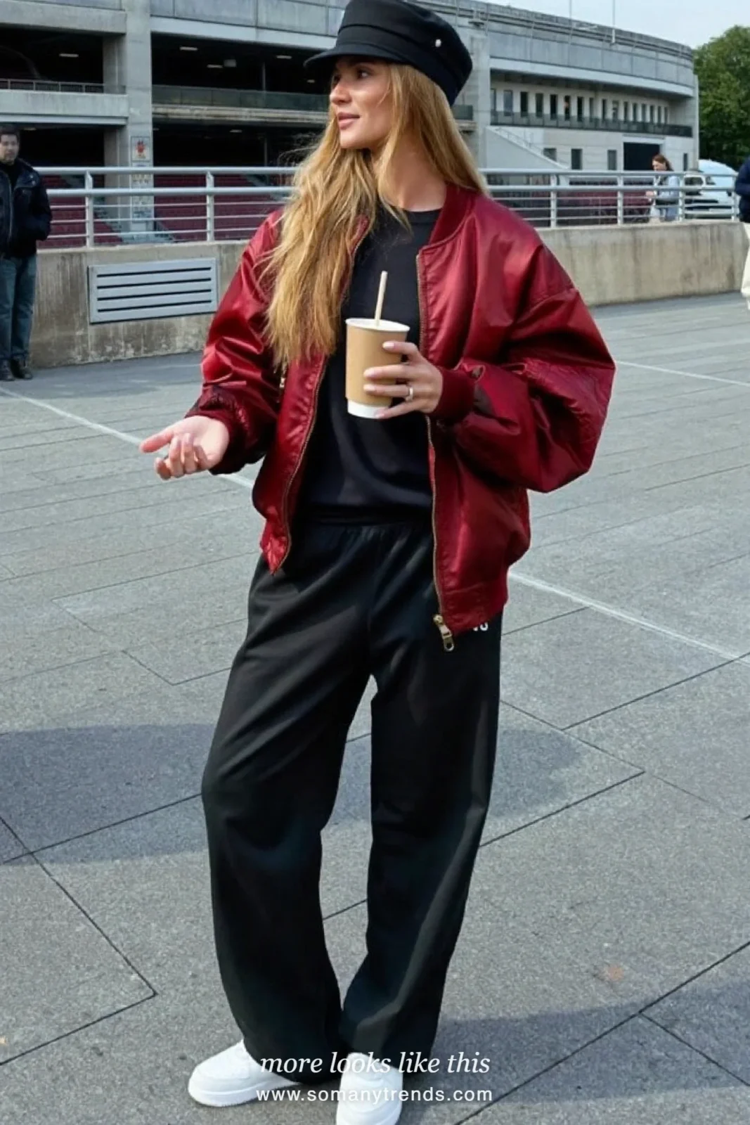 Black tee with wide-leg black track pants, wine bomber jacket and white sneakers, outfit 3