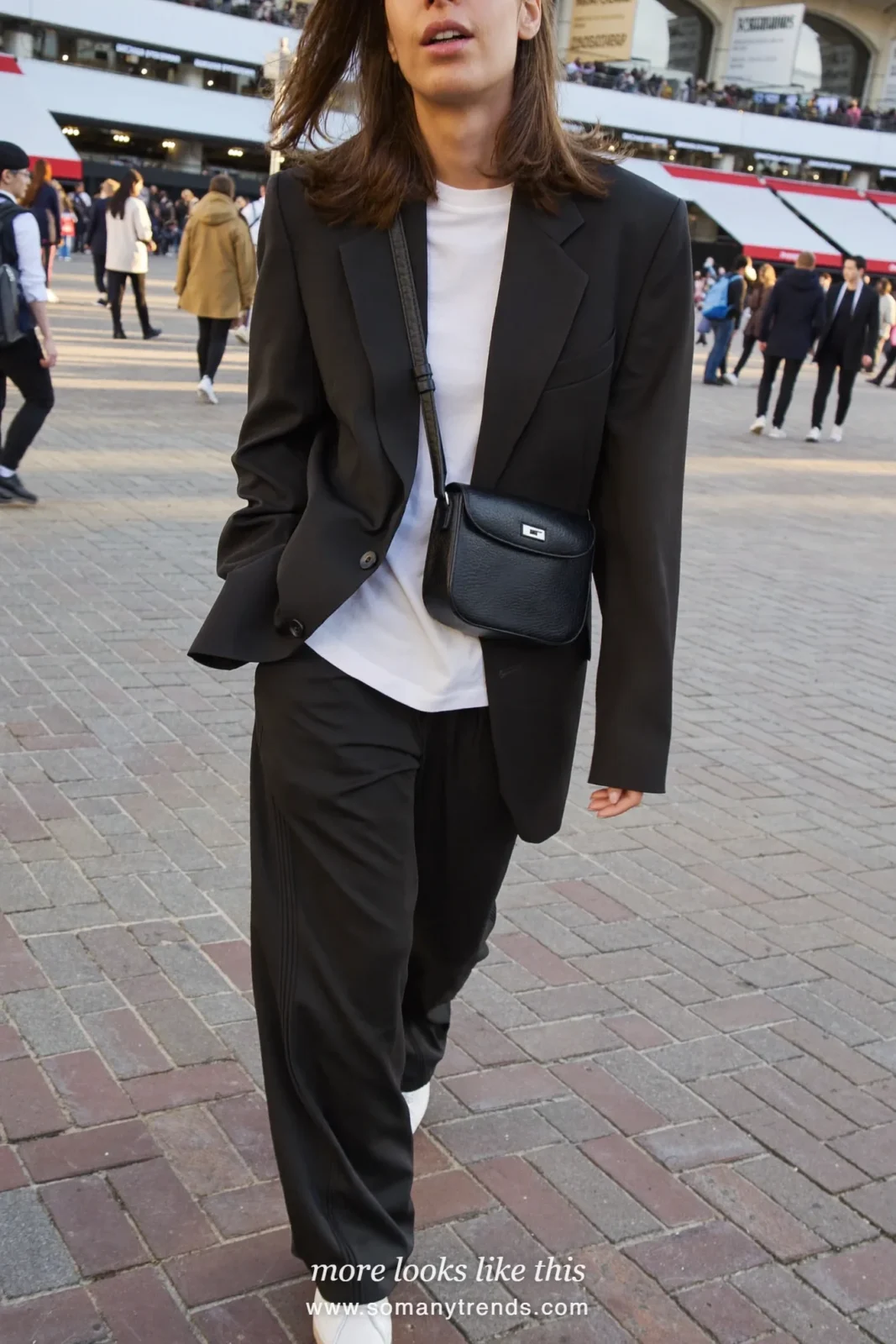 Relaxed black blazer over white tee with wide-leg black track pants and white sneakers, outfit 15