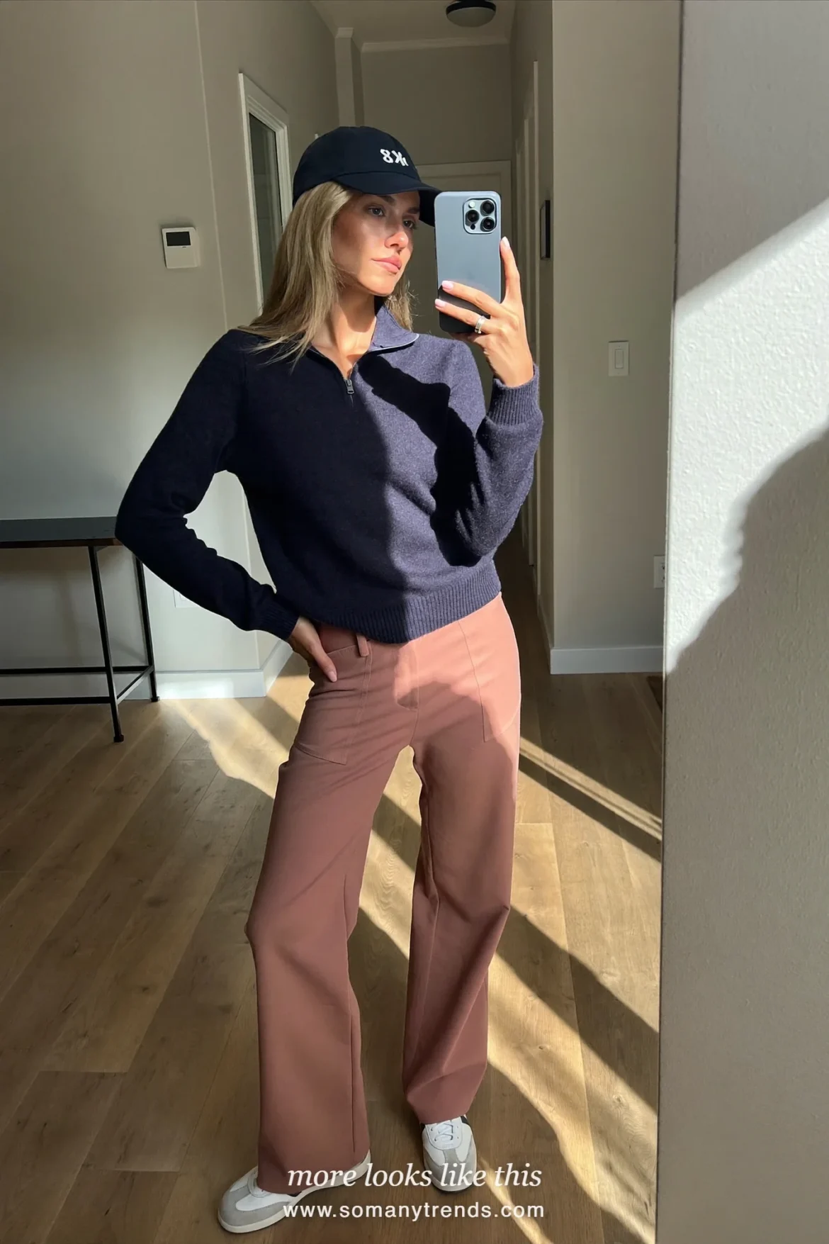 Navy quarter-zip pullover with blush wide-leg pants, white sneakers and navy cap, outfit 16