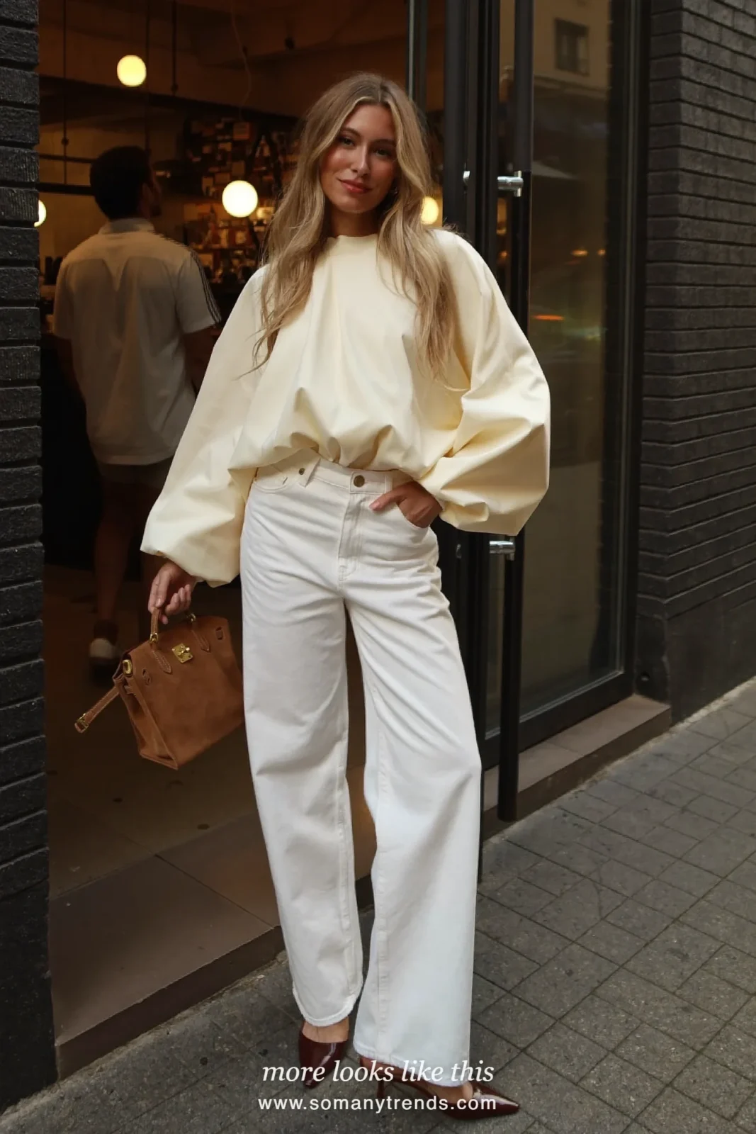 Woman in a cream puff-sleeve blouse, white wide-leg jeans and brown kitten heels, outfit 13