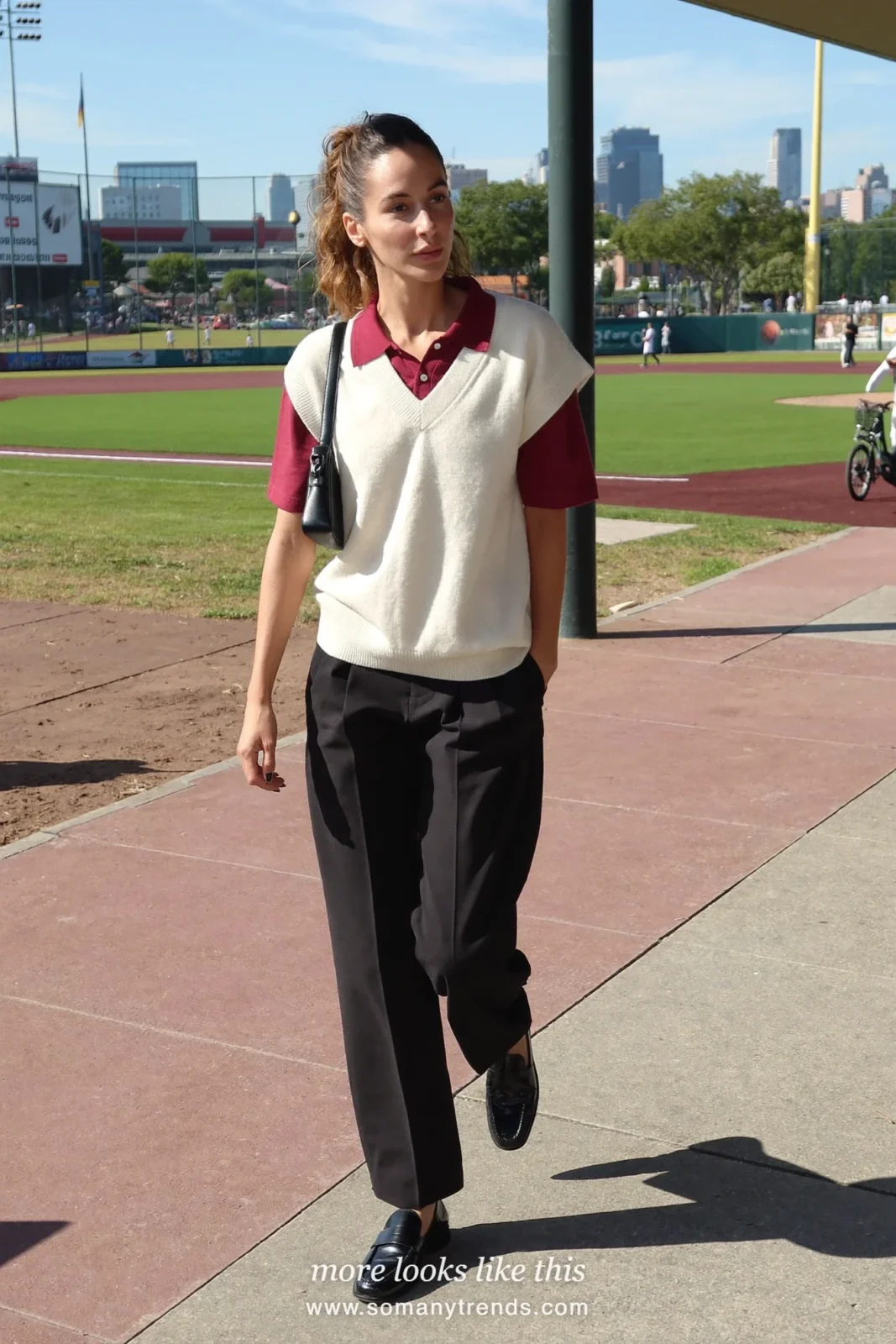 Cream knit vest over wine polo with relaxed black pants and black loafers, outfit 26
