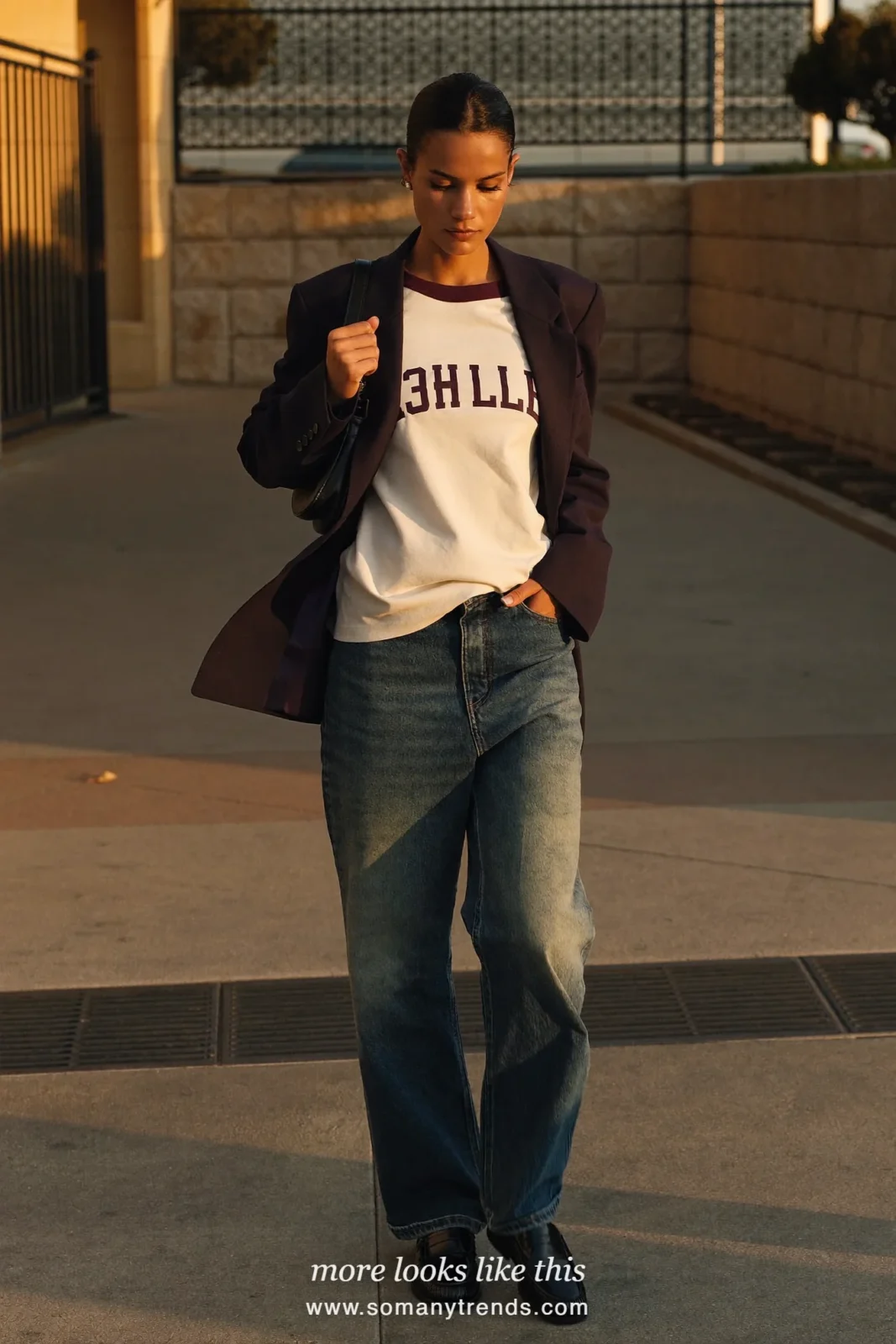 Navy blazer over wine baseball tee with wide-leg jeans, black loafers and small black bag, outfit 31