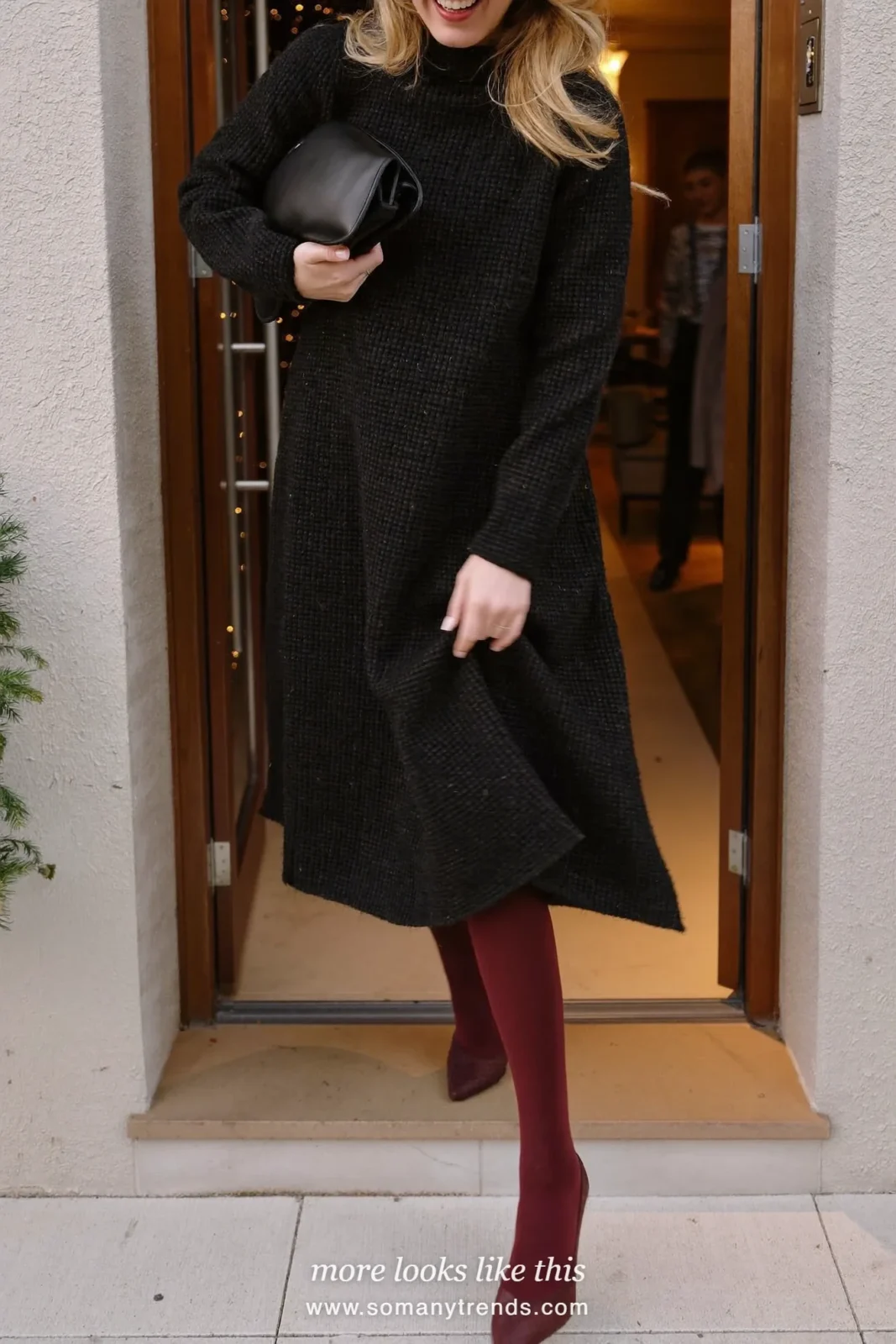 Woman in a black dress, burgundy tights and burgundy pumps at a holiday party, look 9