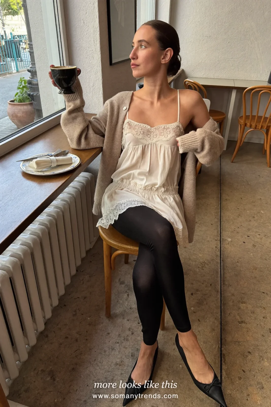 Woman in a lace-trim camisole, oatmeal cardigan, black leggings and black ballet flats, look 23