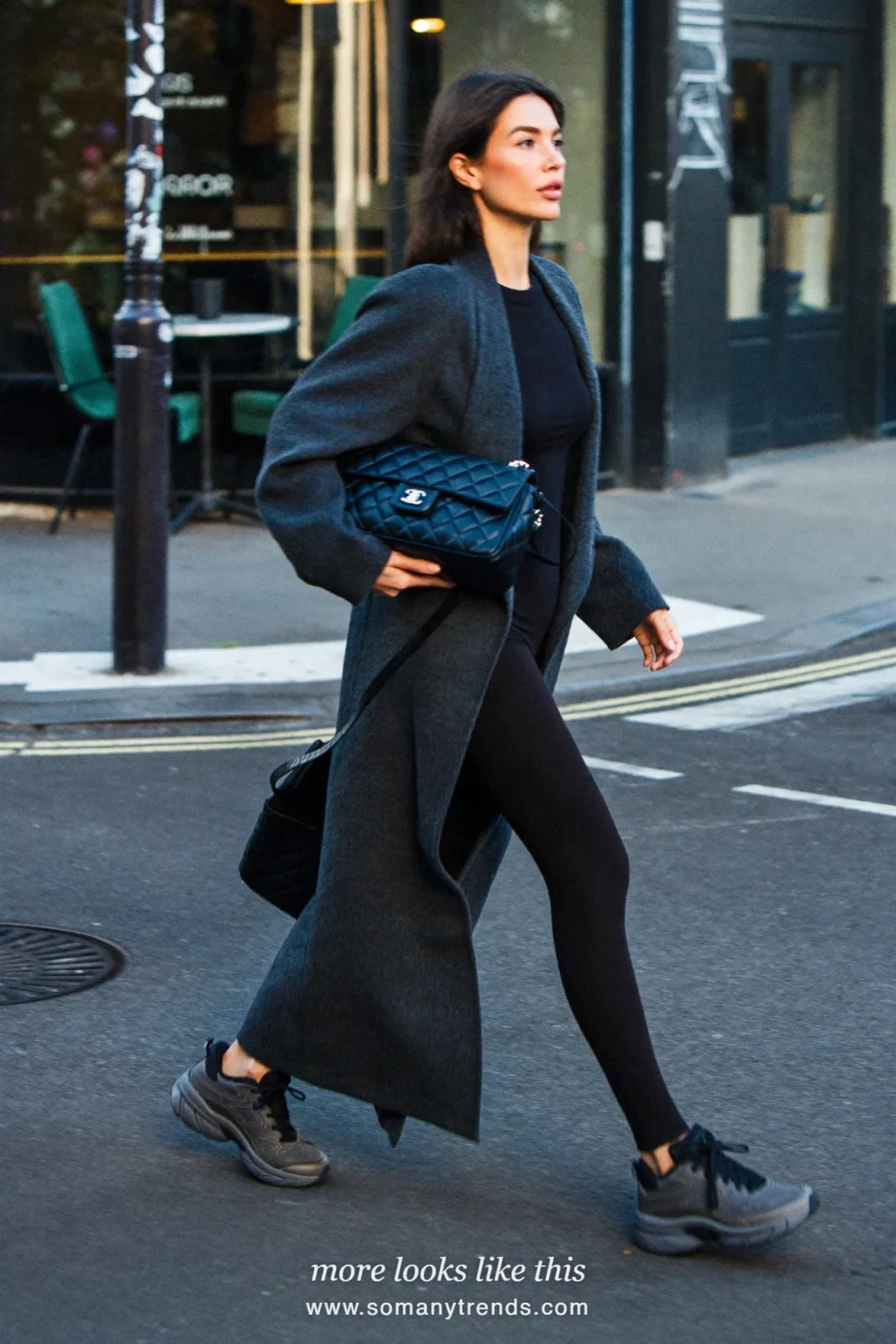 Long charcoal coat, black top, black leggings, gray sneakers and quilted black crossbody bag, outfit 3