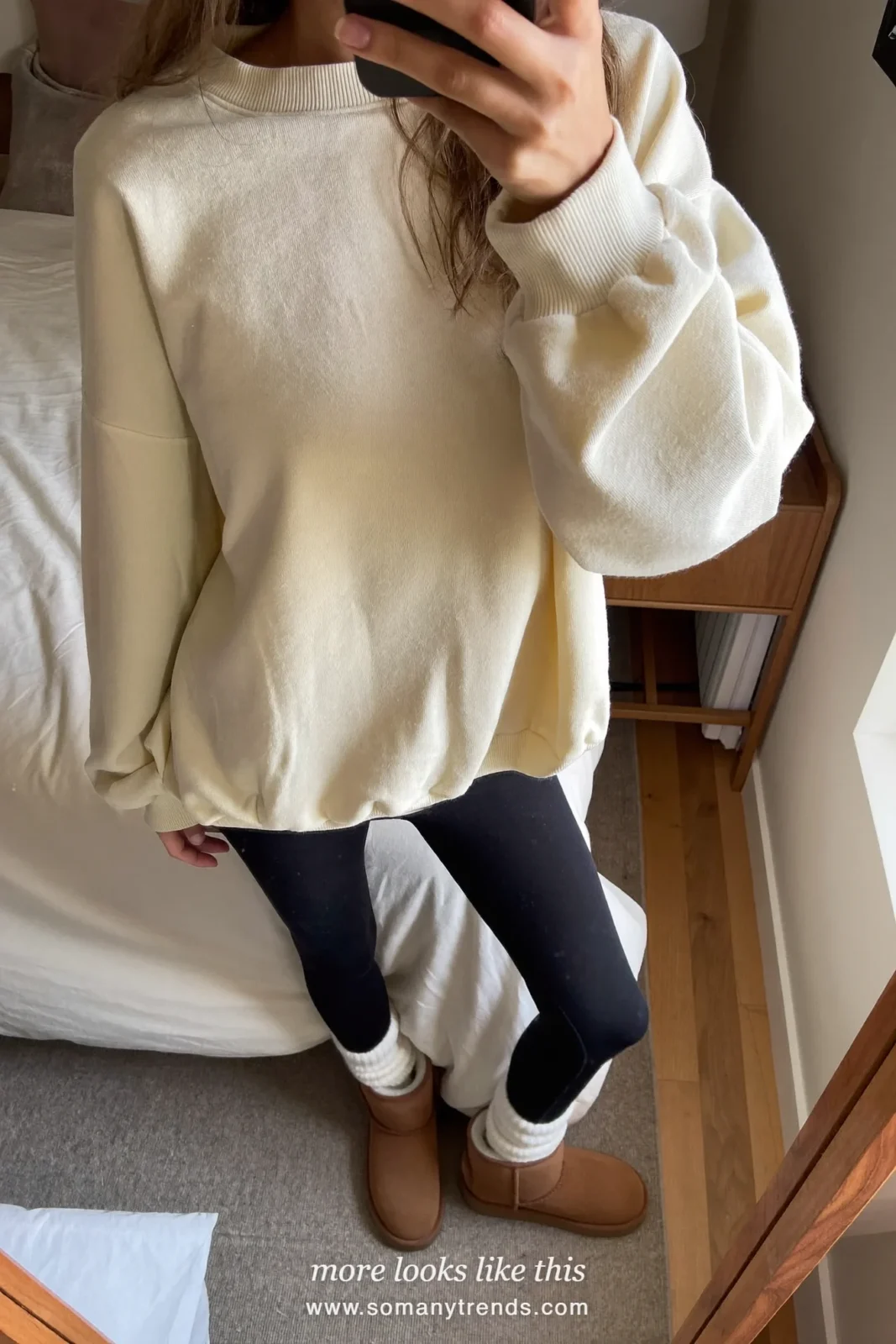 Cream sweatshirt, black leggings, white socks and chestnut mini shearling boots, outfit 16