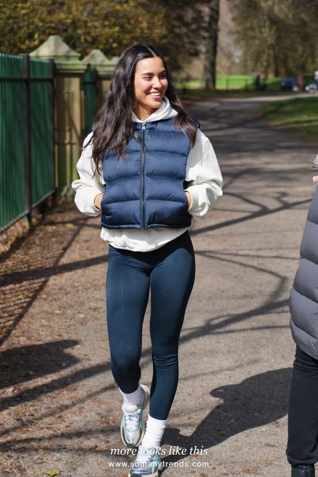 White hoodie, navy puffer vest, navy leggings, white socks and silver sneakers, outfit 26