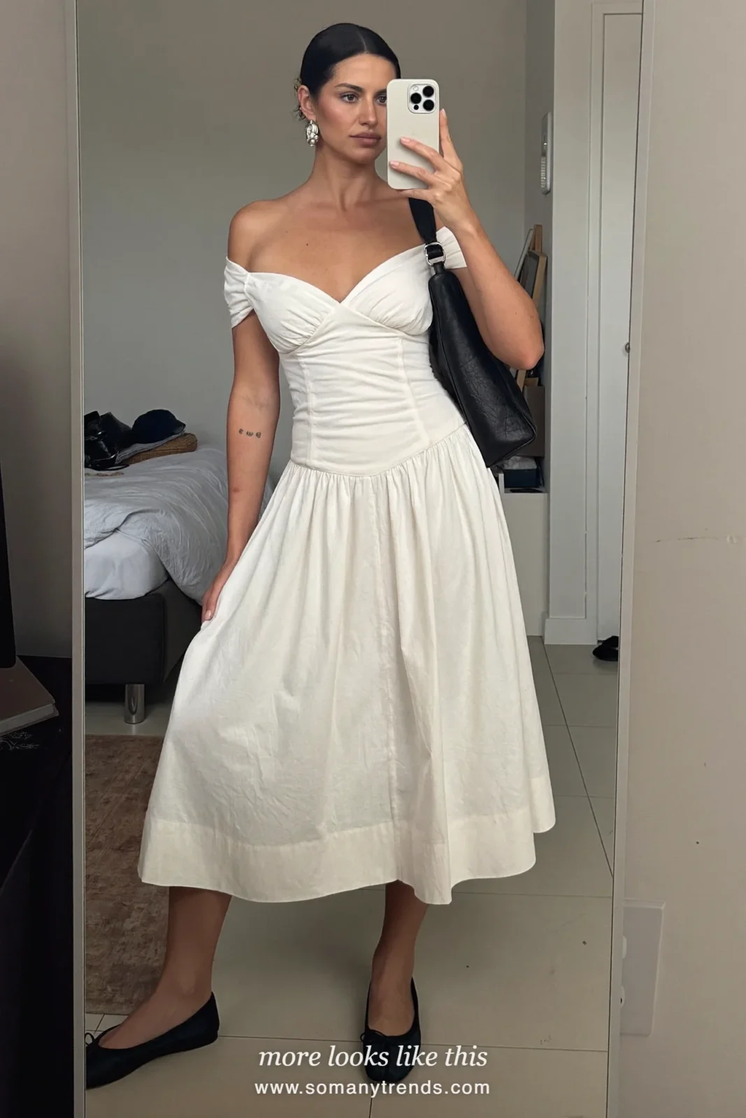 Woman in an ivory off-the-shoulder poplin midi dress, black flats and black shoulder bag, mirror selfie at home, cocktail outfit 4