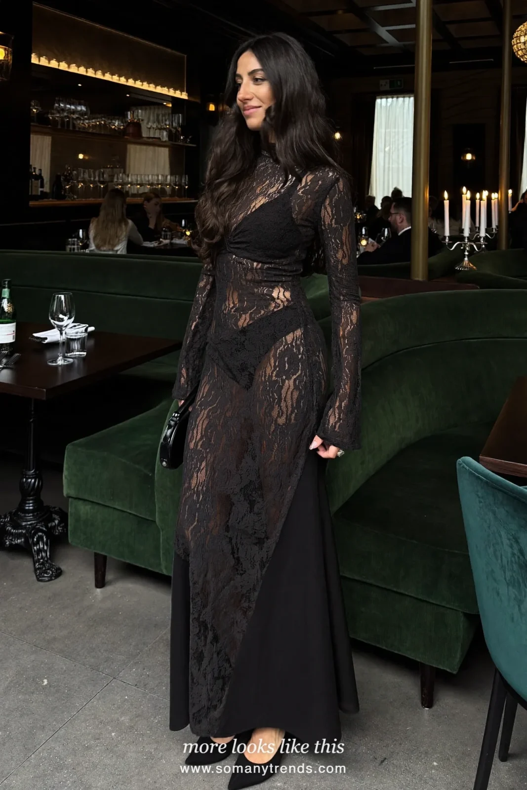 Woman in a long-sleeve black lace maxi dress, black heels and small studs, cocktail outfit 7