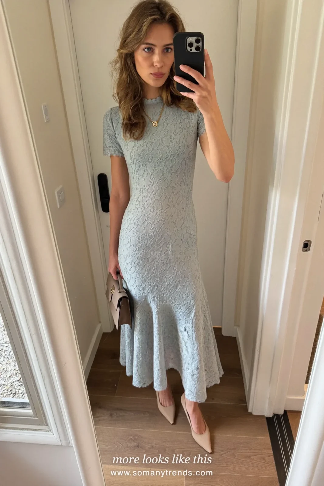 Woman in a powder blue lace midi dress, nude pumps and a small bag, cocktail outfit 24