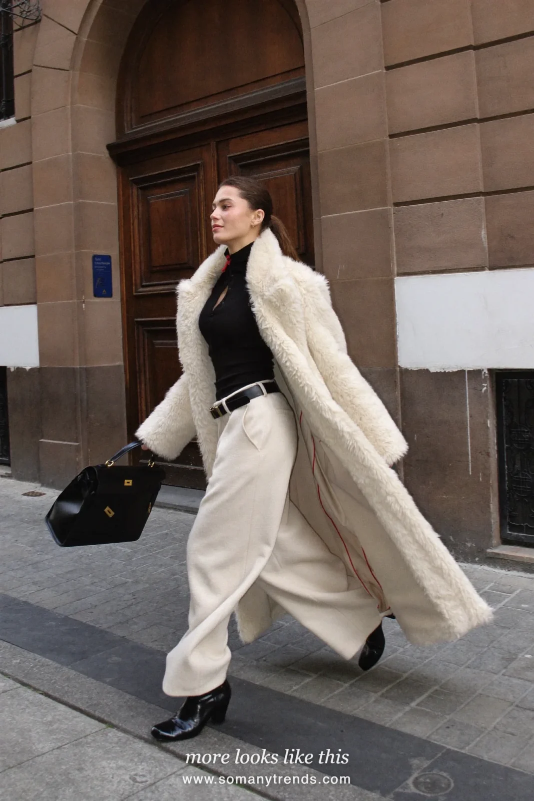 Long cream faux-fur coat, cream wide-leg pants, black top-handle bag and black ankle boots, outfit 5