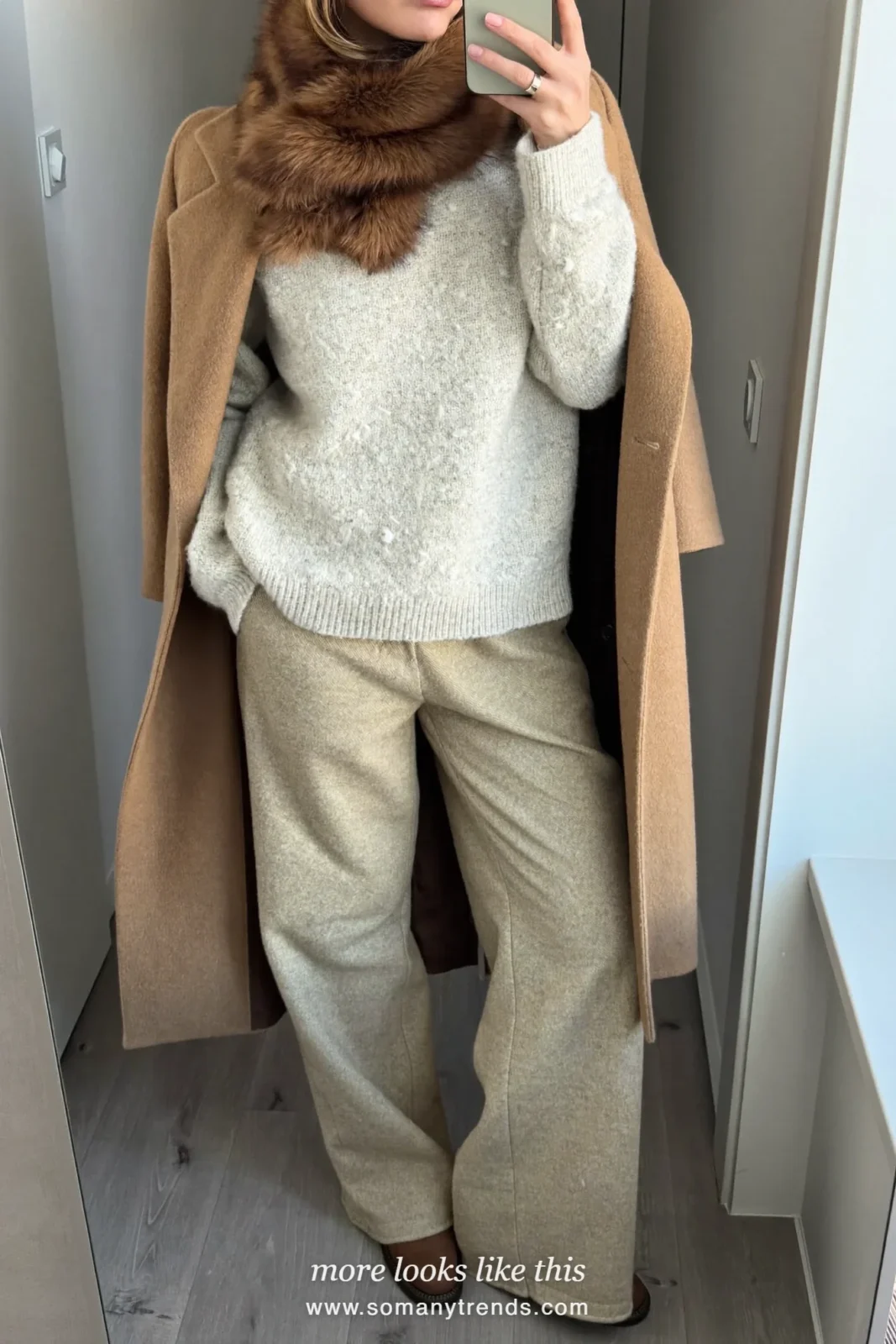 Brown faux-fur scarf over a tan wool coat, oatmeal pants and brown leather boots, outfit 16