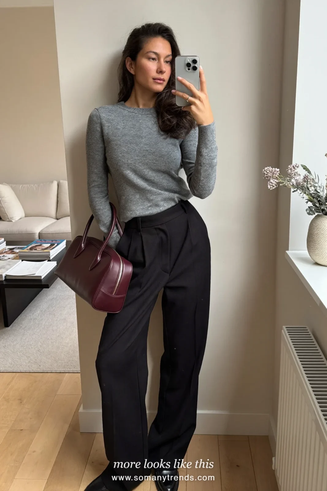 Long black coat, charcoal knit, black pants, burgundy bag and black loafers, outfit 28