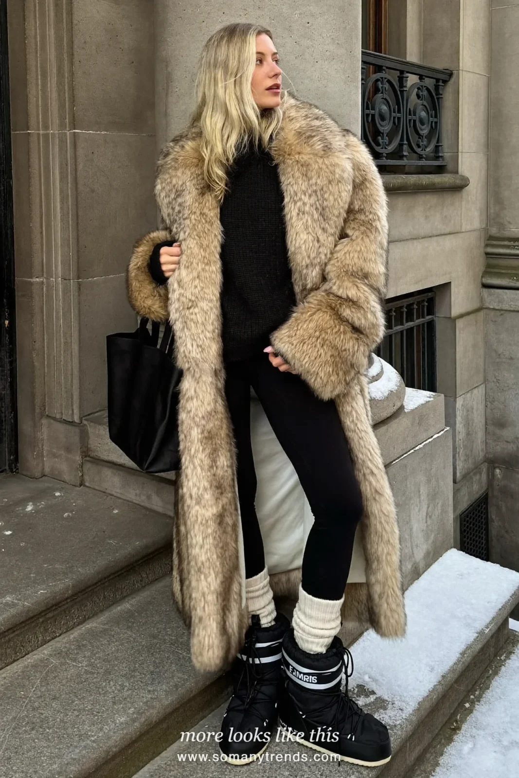 Long tan faux-fur coat with black knit sweater, black leggings, cream socks and black snow boots on snowy steps, outfit 1