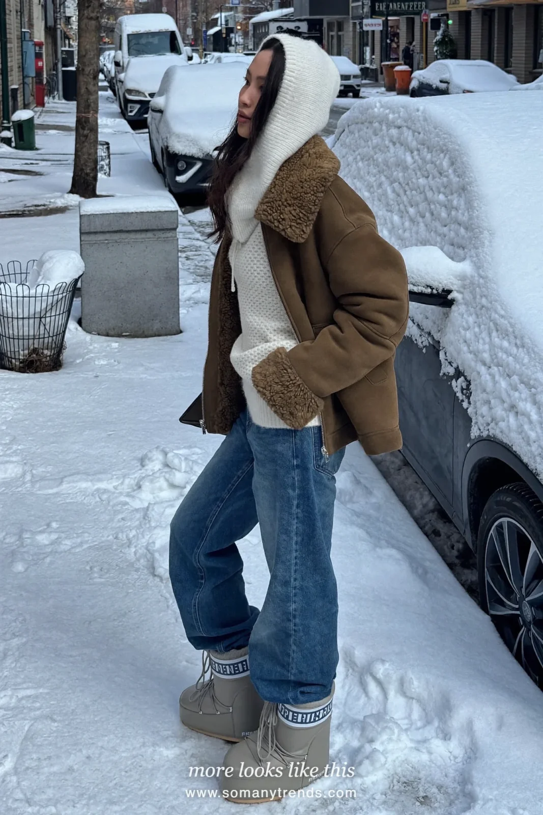 Shearling jacket with knitted hood, wide-leg jeans and moon boots on a snowy street, outfit 5