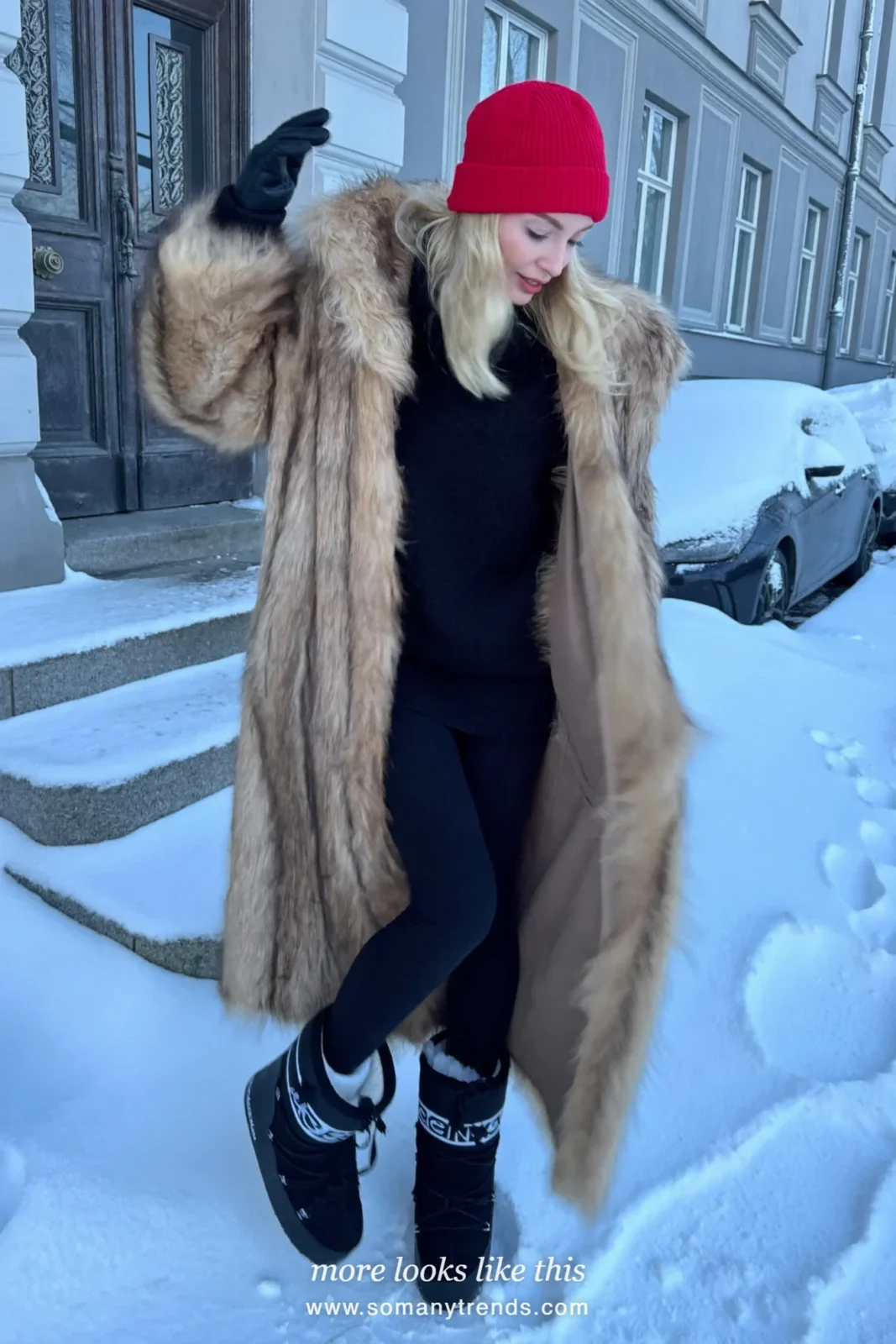 Long tan faux-fur coat with black leggings, red beanie, black gloves and snow boots on snowy steps, outfit 27