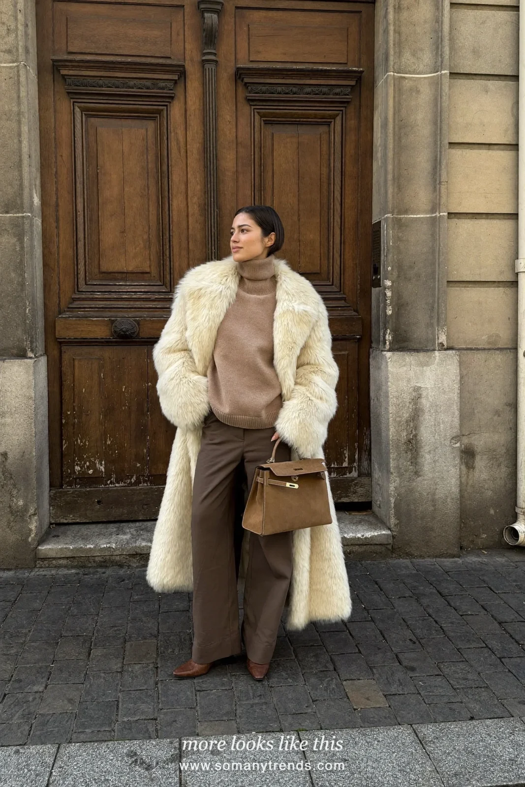 Cream faux fur coat over a camel turtleneck, chocolate brown wide-leg pants and brown leather ankle boots, outfit 6