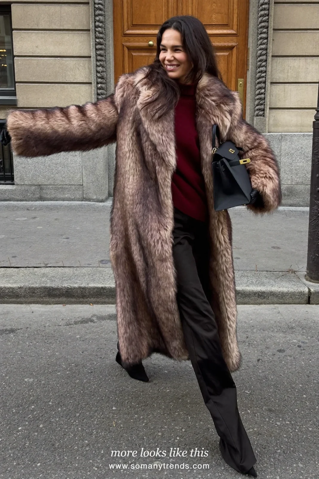 Long mink-brown faux fur coat over a burgundy sweater, black pants, black gloves and a black top-handle bag, outfit 9