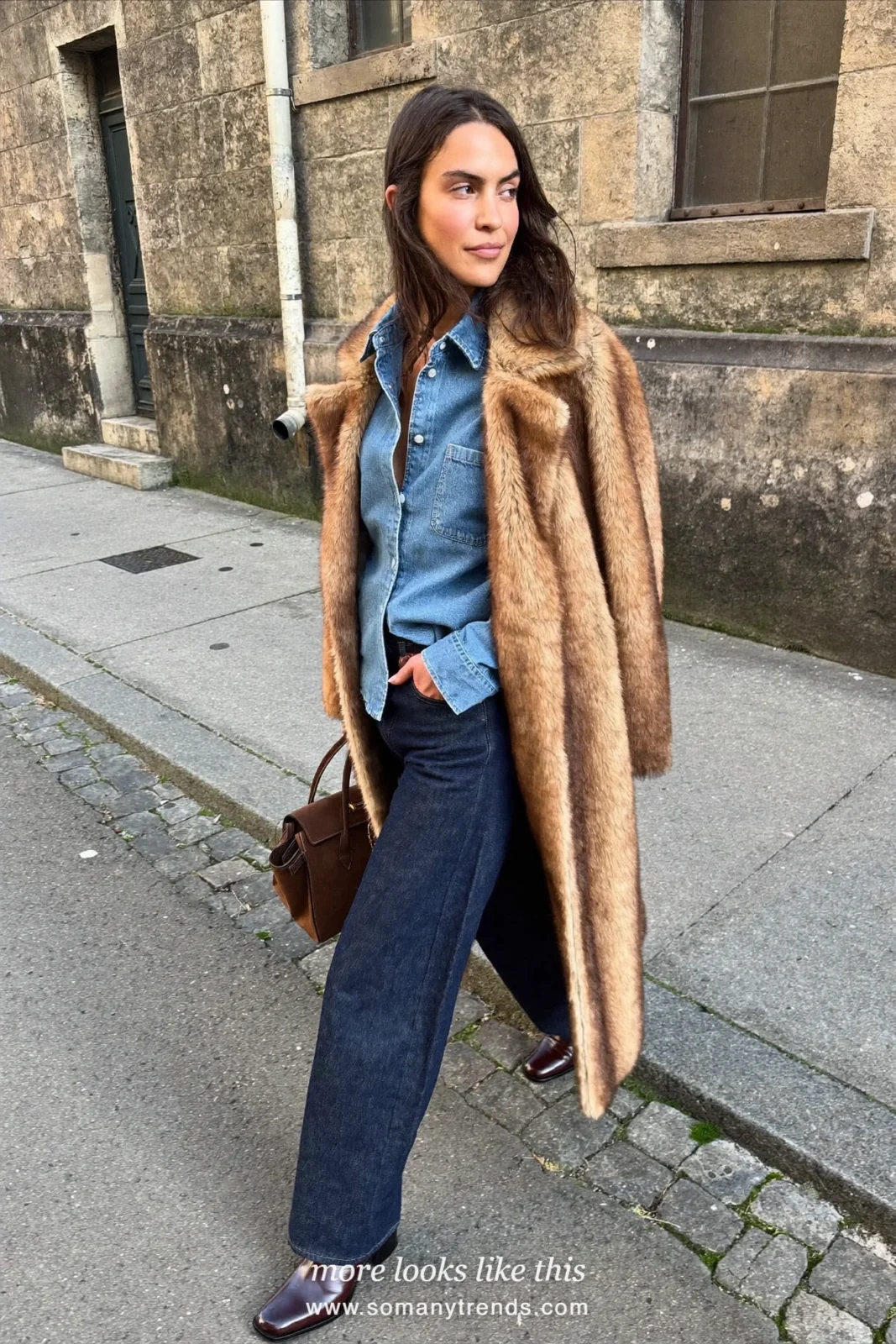 Long tan faux fur coat over a light denim shirt, dark straight jeans and brown ankle boots, outfit 19