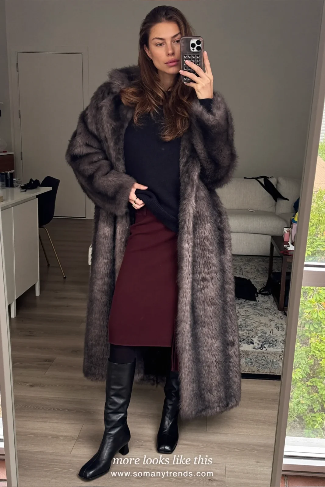 Charcoal faux fur coat over a black sweater, burgundy midi skirt, black tights and tall black boots, outfit 20