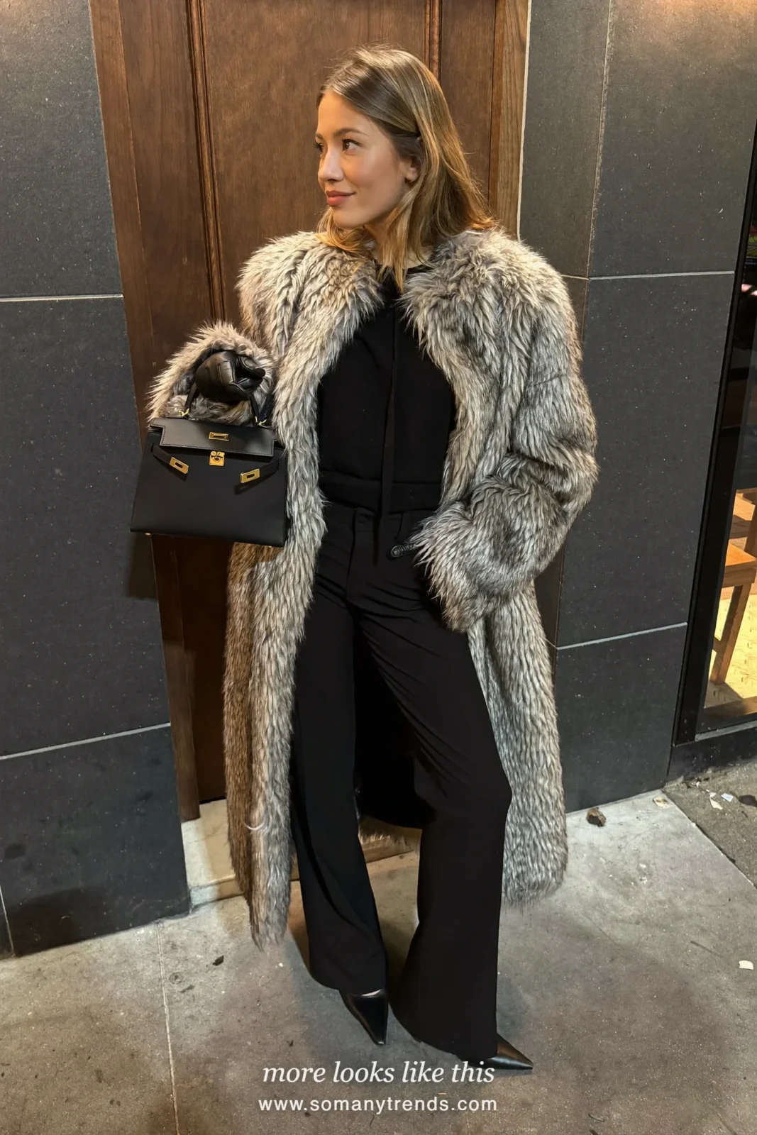 Long gray shaggy faux fur coat over a black knit top, black tailored pants, black gloves and pointed pumps, outfit 29